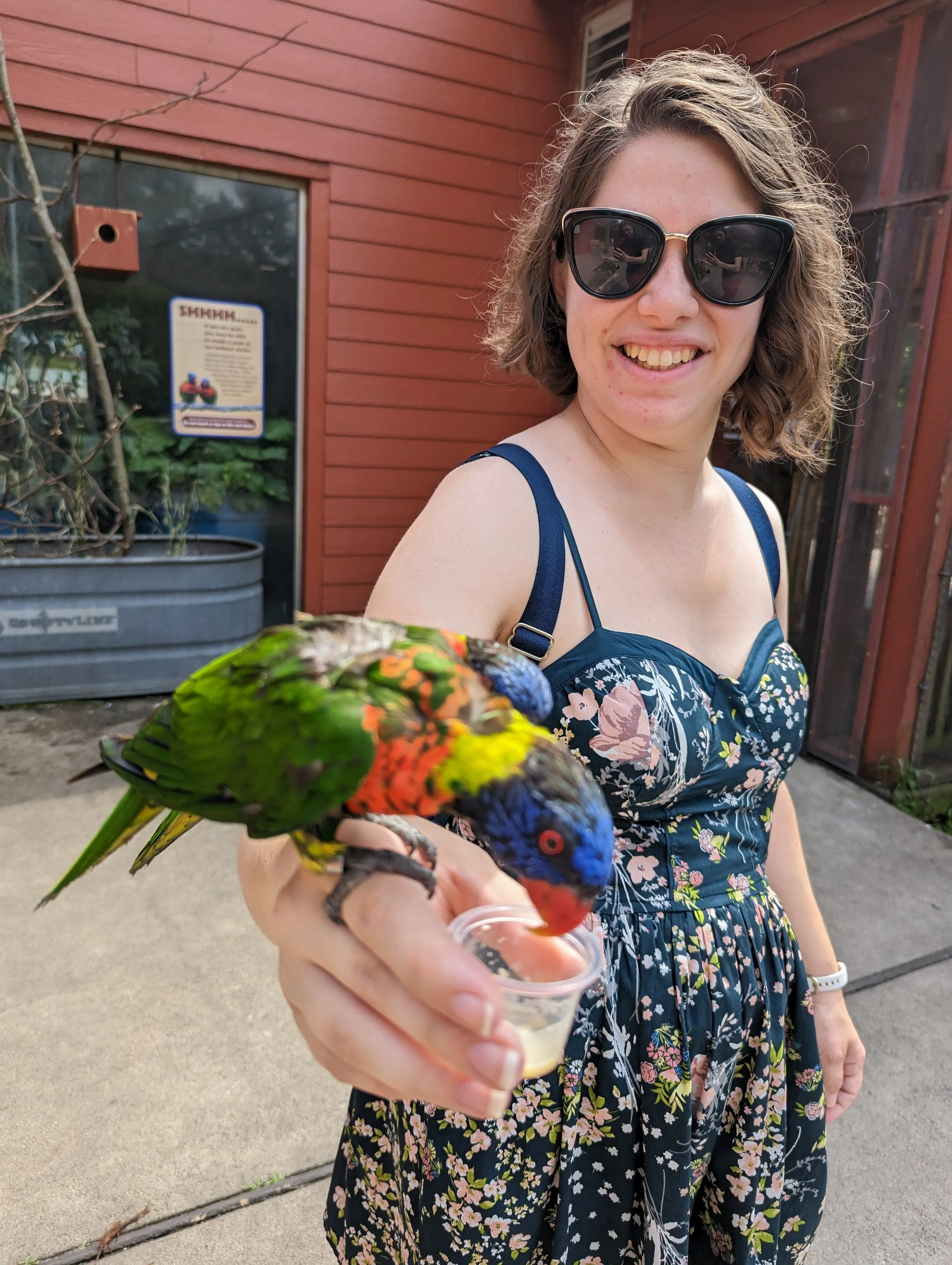 Natasha feeding a bird at the Riverbanks Zoo!