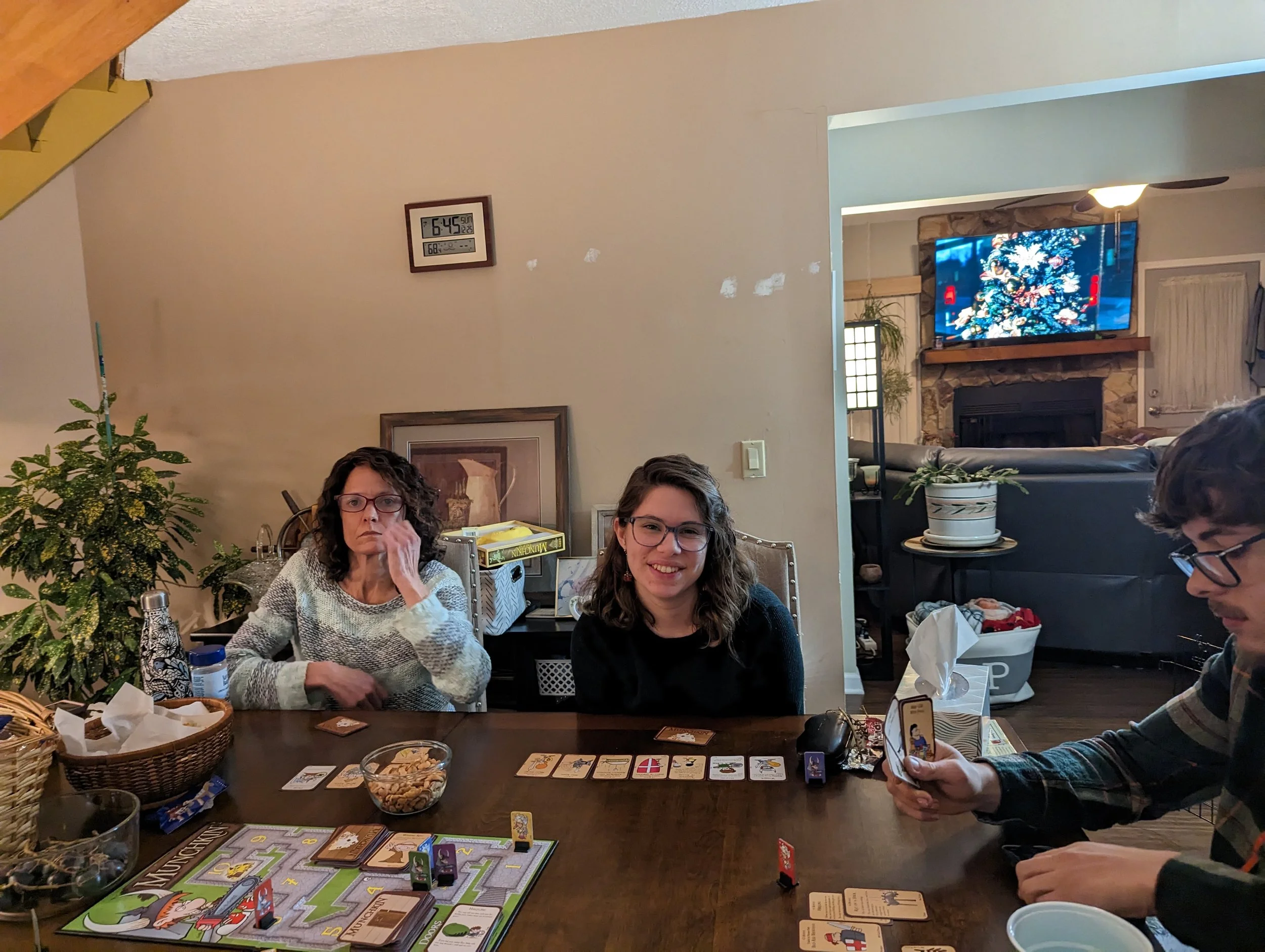 Natasha and Robert's family, very excited to be playing Munchkin! (Left to right: Tina, Natasha, Brother Matthew)