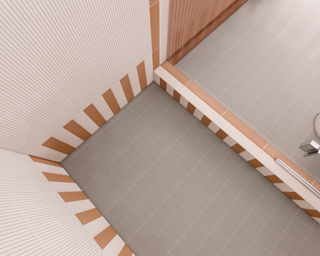 Contemporary shower details showing pale sage green mosaic floor, textured white wall tile, and peach and white stripe tile border accents