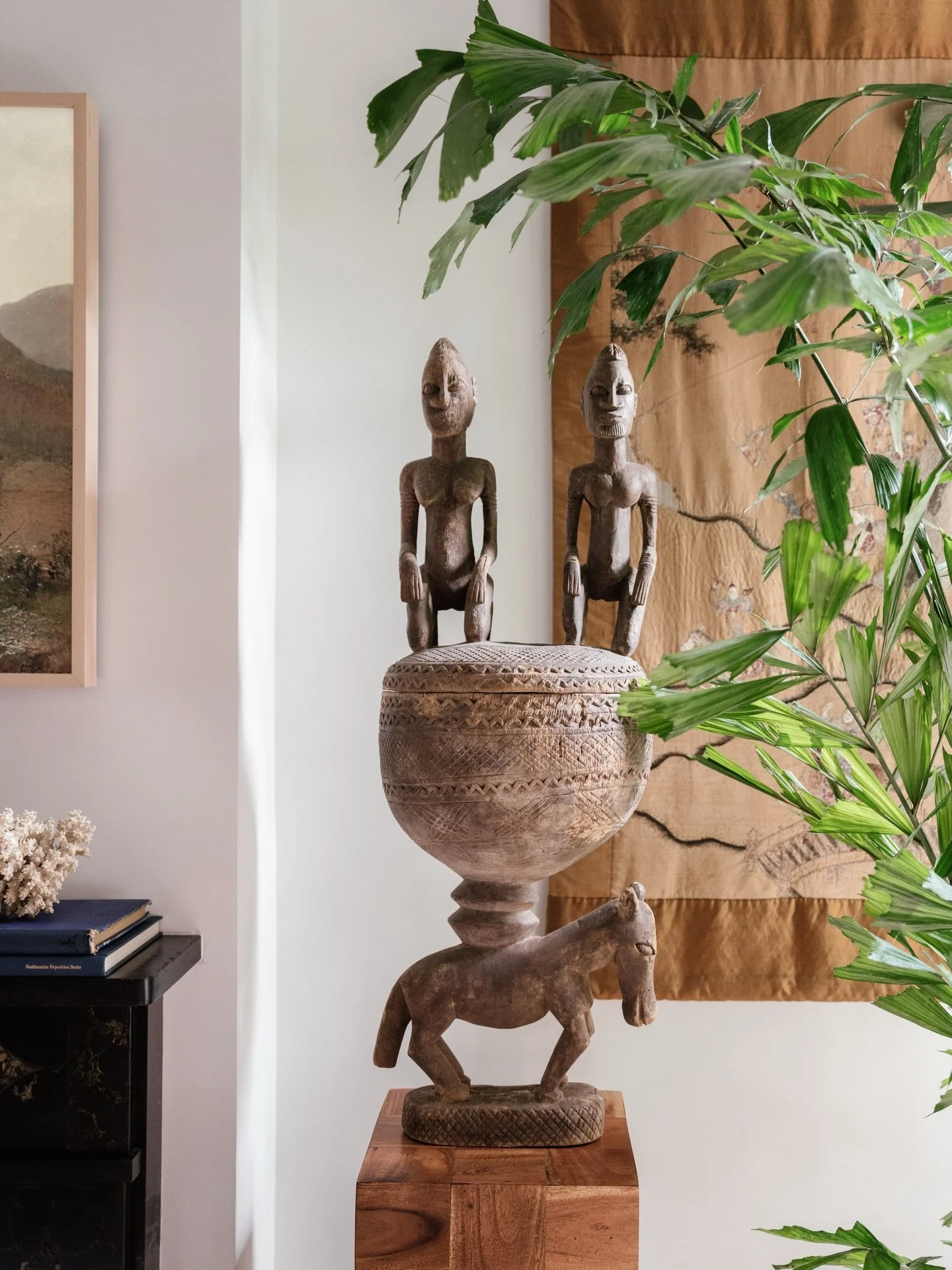 Textured layers.
⠀⠀⠀⠀⠀⠀⠀⠀⠀
An antique Chinese tapestry, a fishtail palm, vintage tourist art and salvaged coral set against the backdrop of an original marbleized soapstone mantle and end grain pedestal. 
⠀⠀⠀⠀⠀⠀⠀⠀⠀
Love how all the elements come toge
