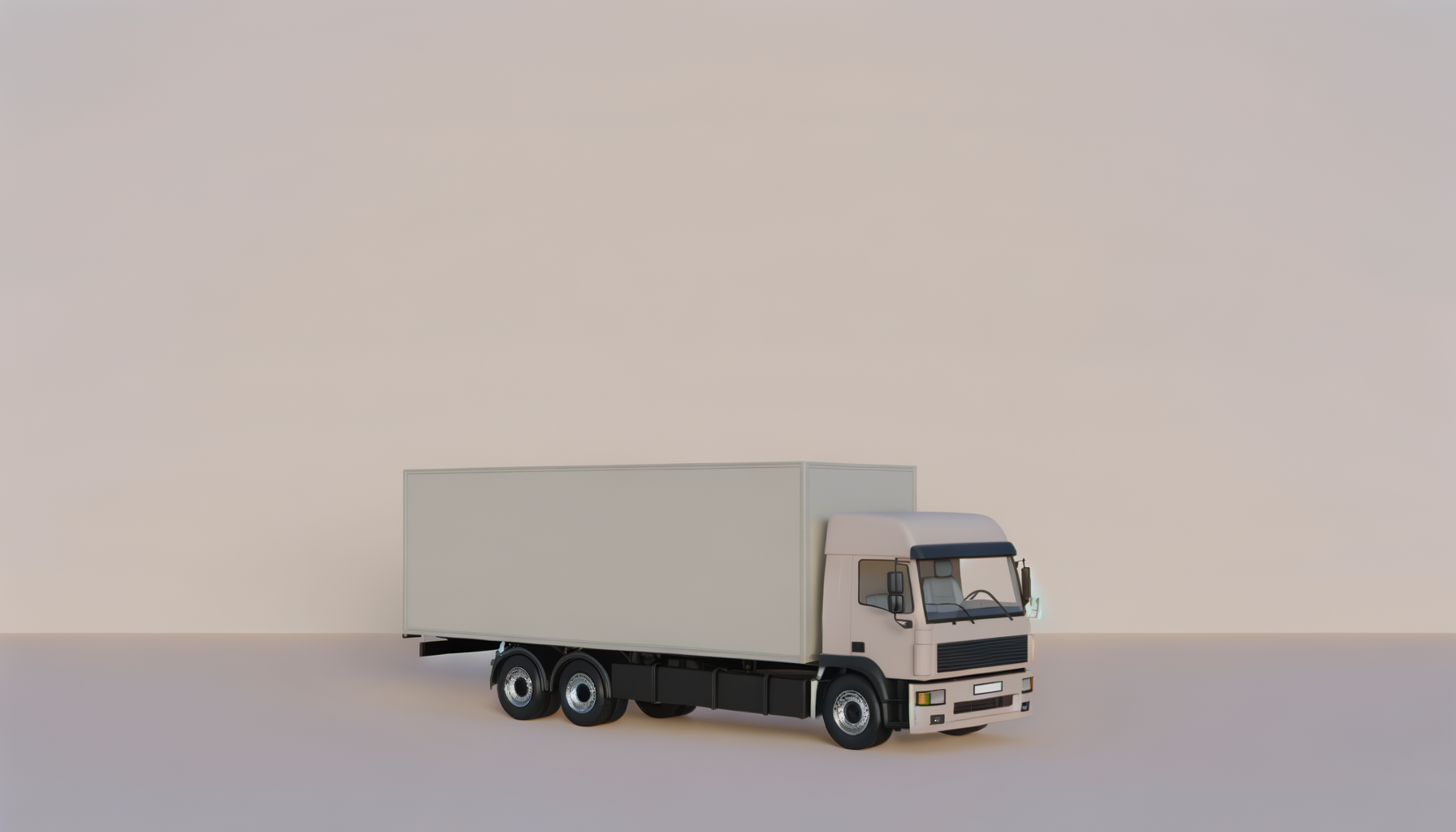 A white delivery truck with a large cargo box parked against a plain, light-colored background.