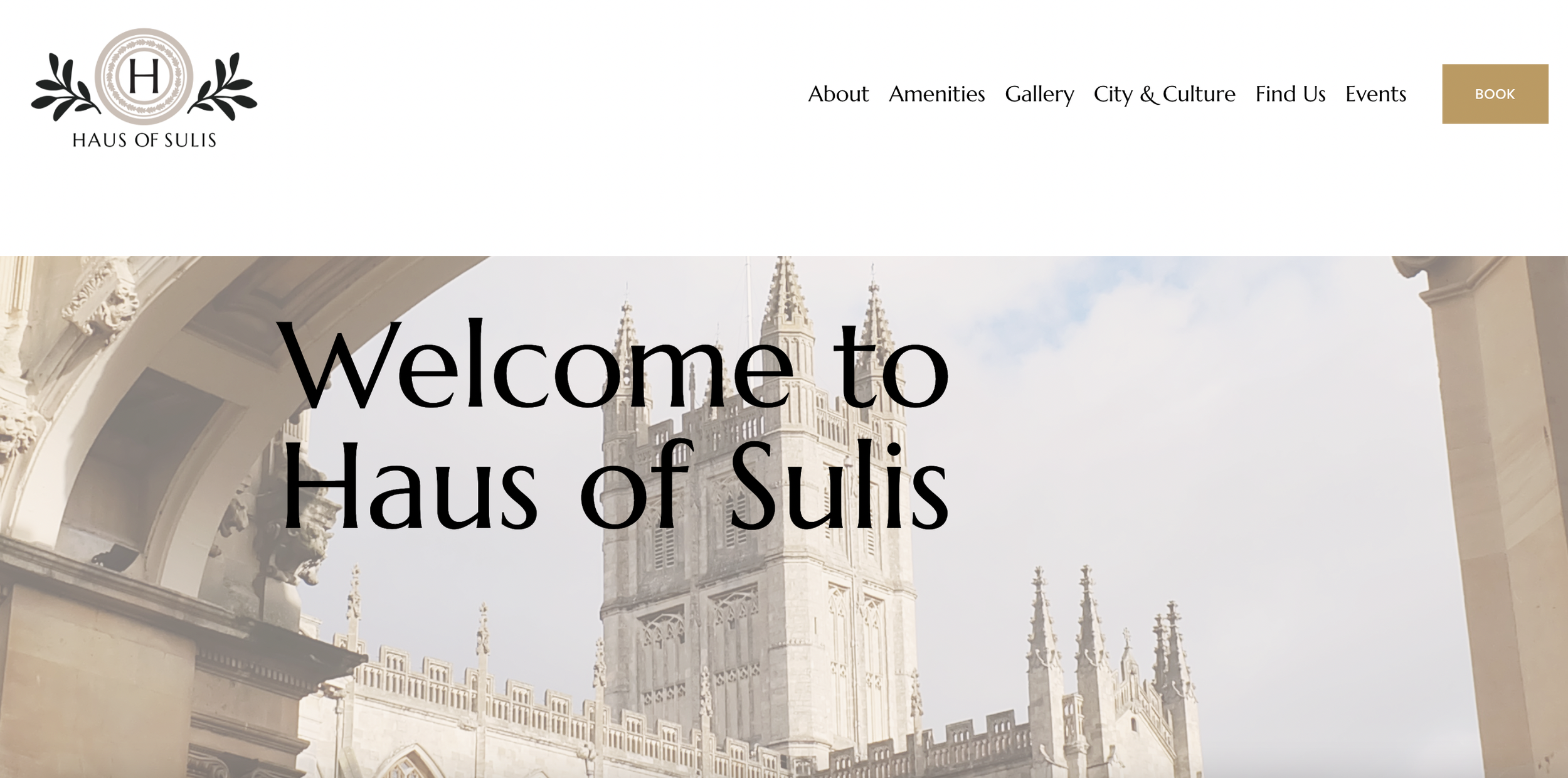 Screenshot of the homepage of Haus of Sulis website featuring a large photo of a historic building with Gothic architectural style and a welcoming message.