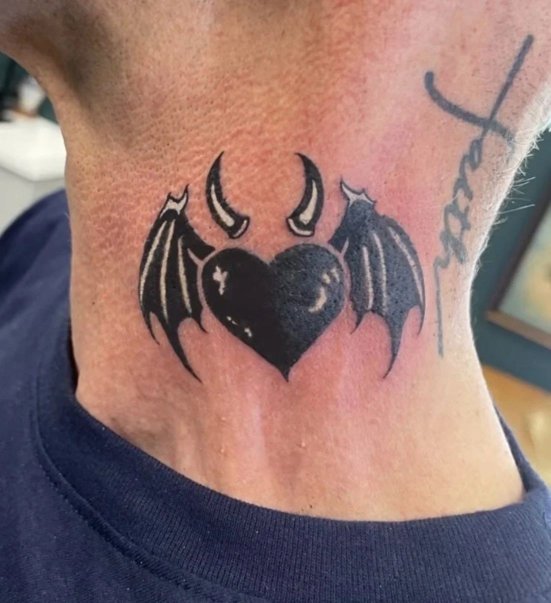 Tattoo of a heart with devil wings and horns Shelton CT