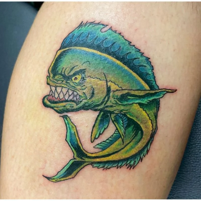 Green and Yellow Mahi Mahi Fish Tattoo on a mans arm in Shelton