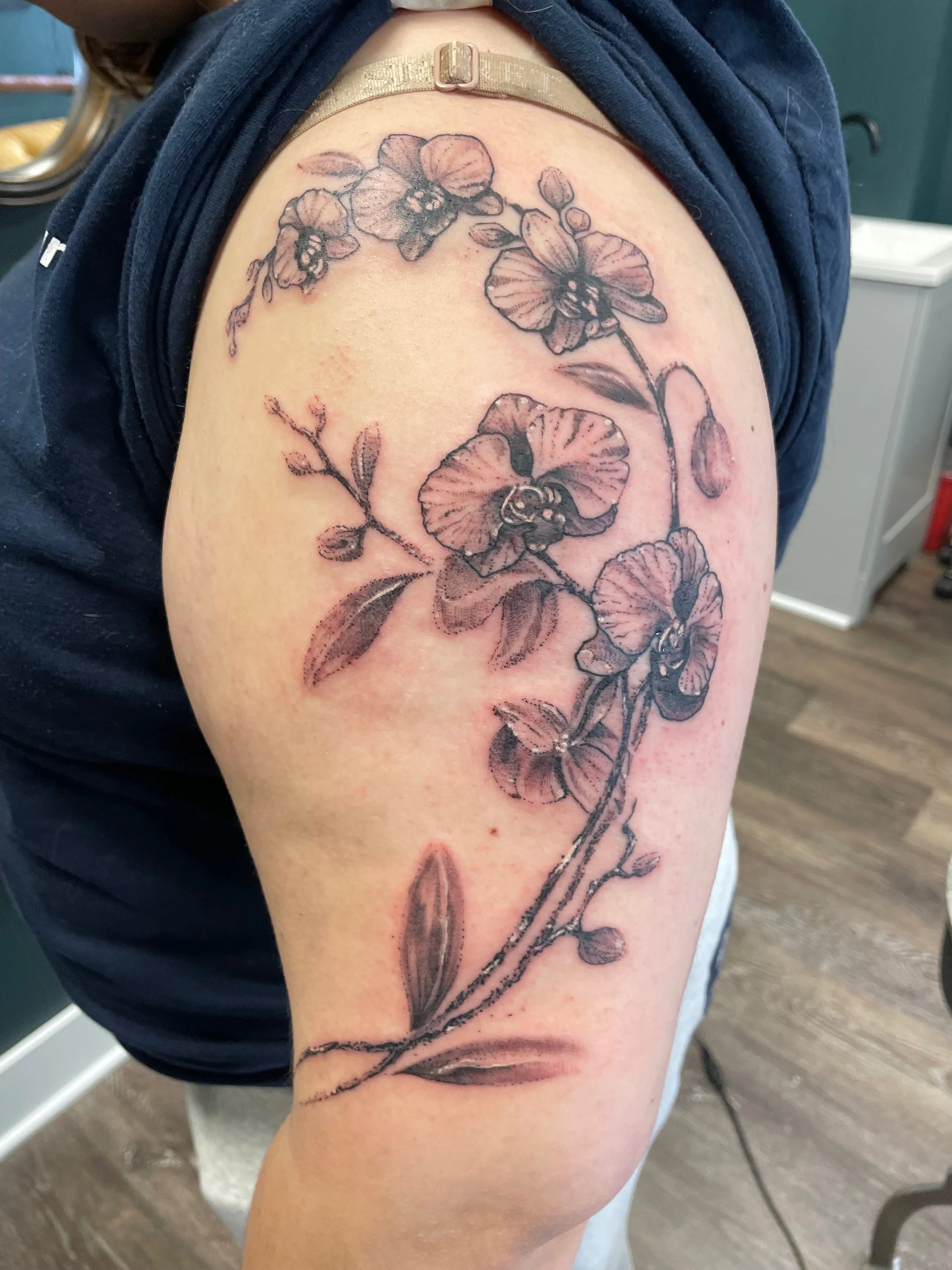 Orchid tattoo on arm shelton ct
