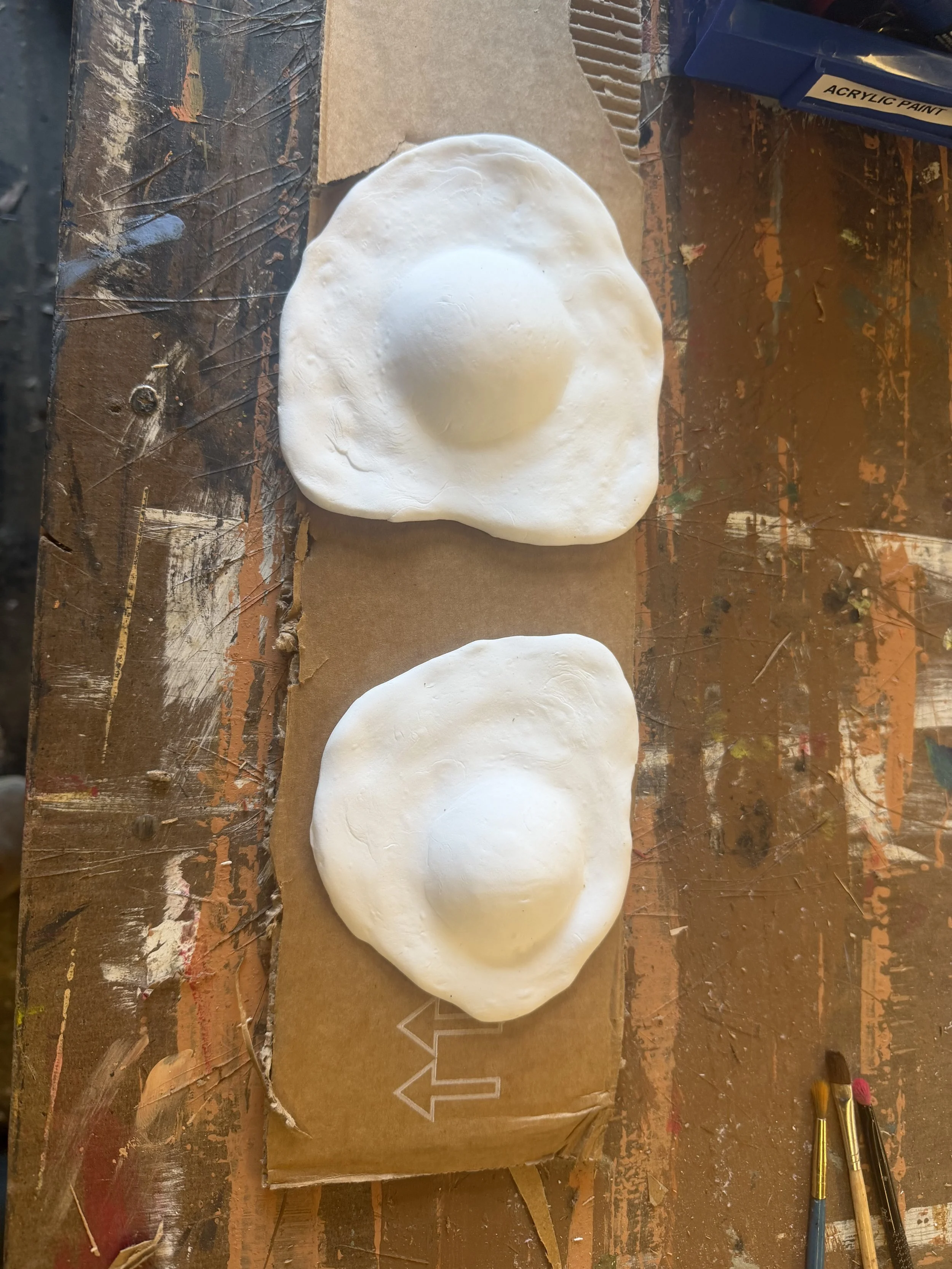 Unpainted fried eggs in foam clay