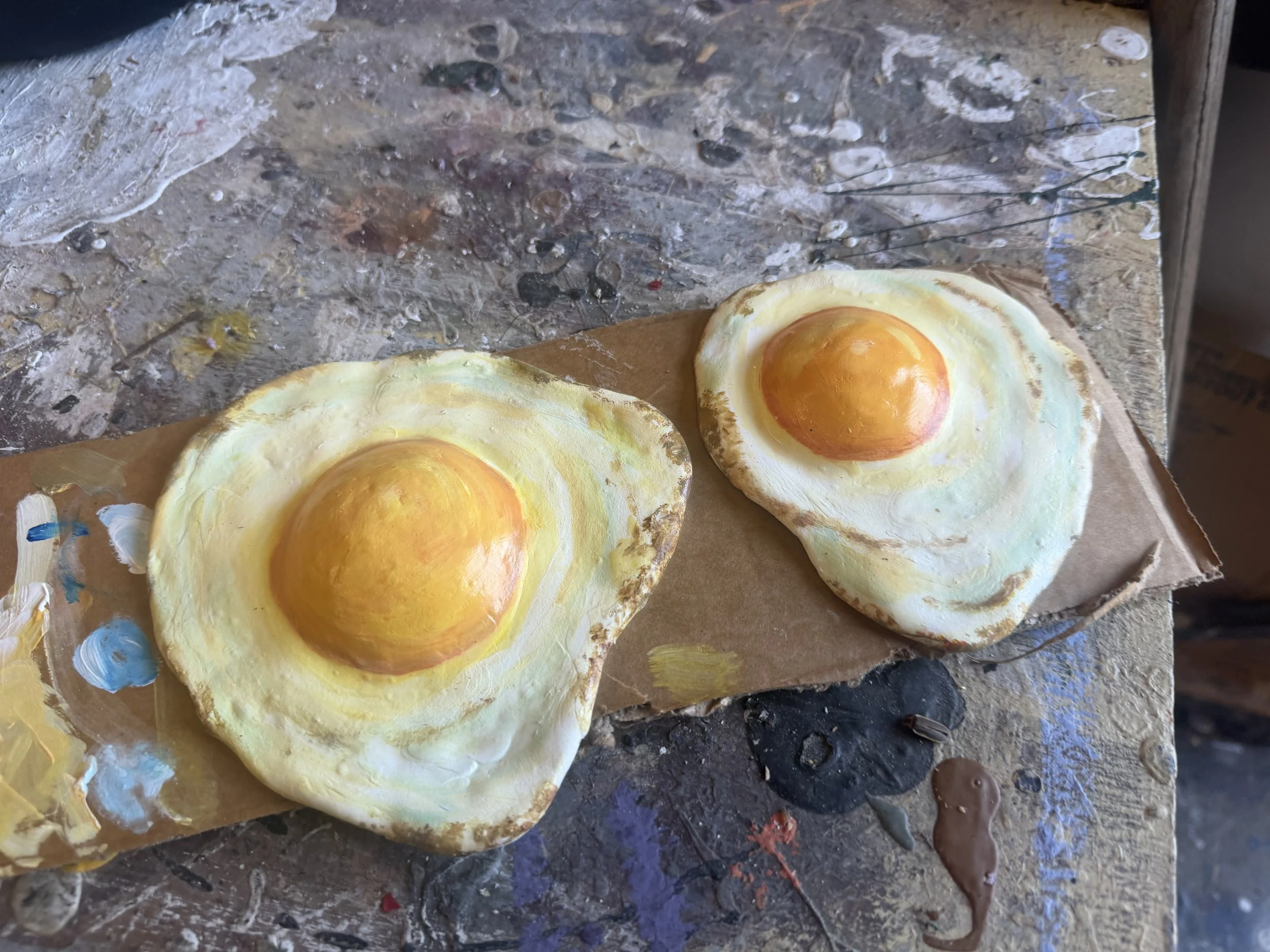 Two fried eggs sculpted with foam clay