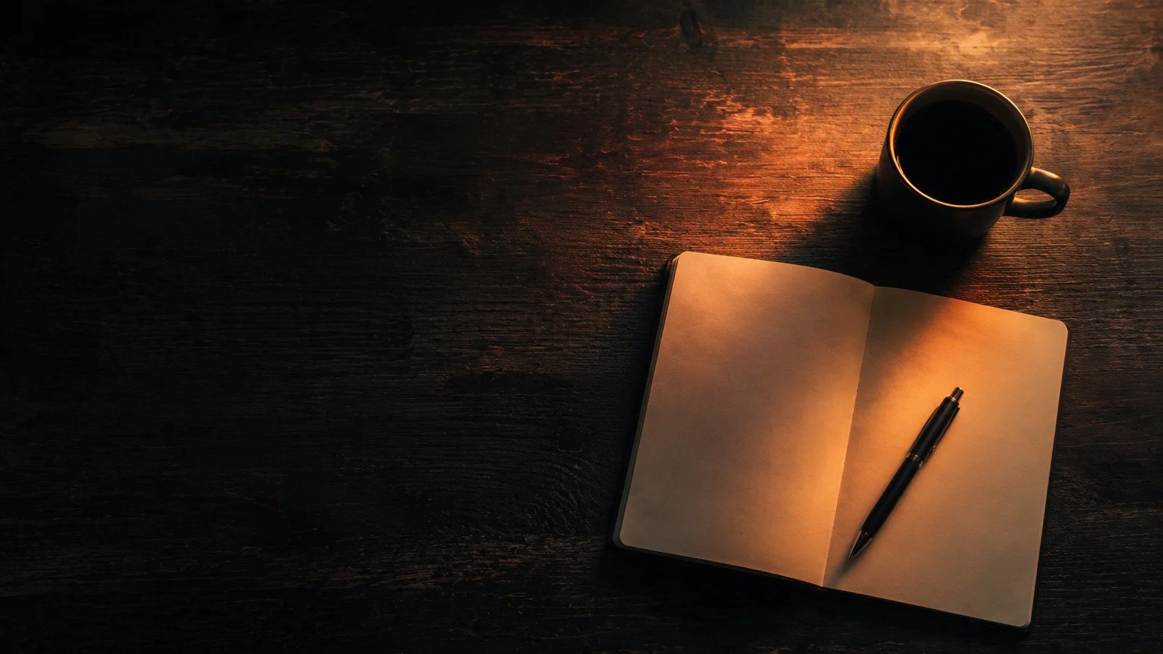 A dark wooden desk with a lit candle, an open blank notebook, a black pen, and a coffee mug. TASR CONSULTING HERO TAKE ACTION SEE RESULTS MEN SELF HELP.