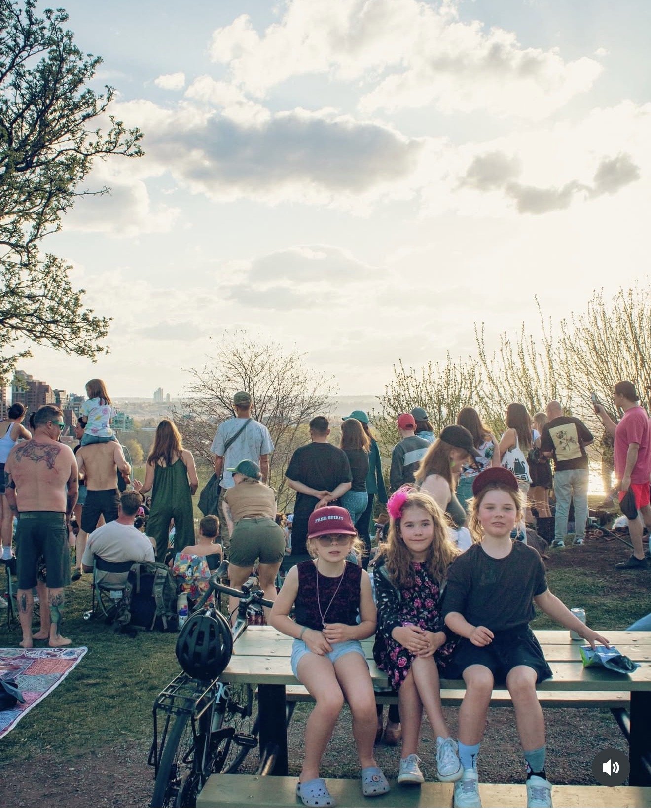 Attendees enjoying a Dos Leches sunset event in a Calgary park