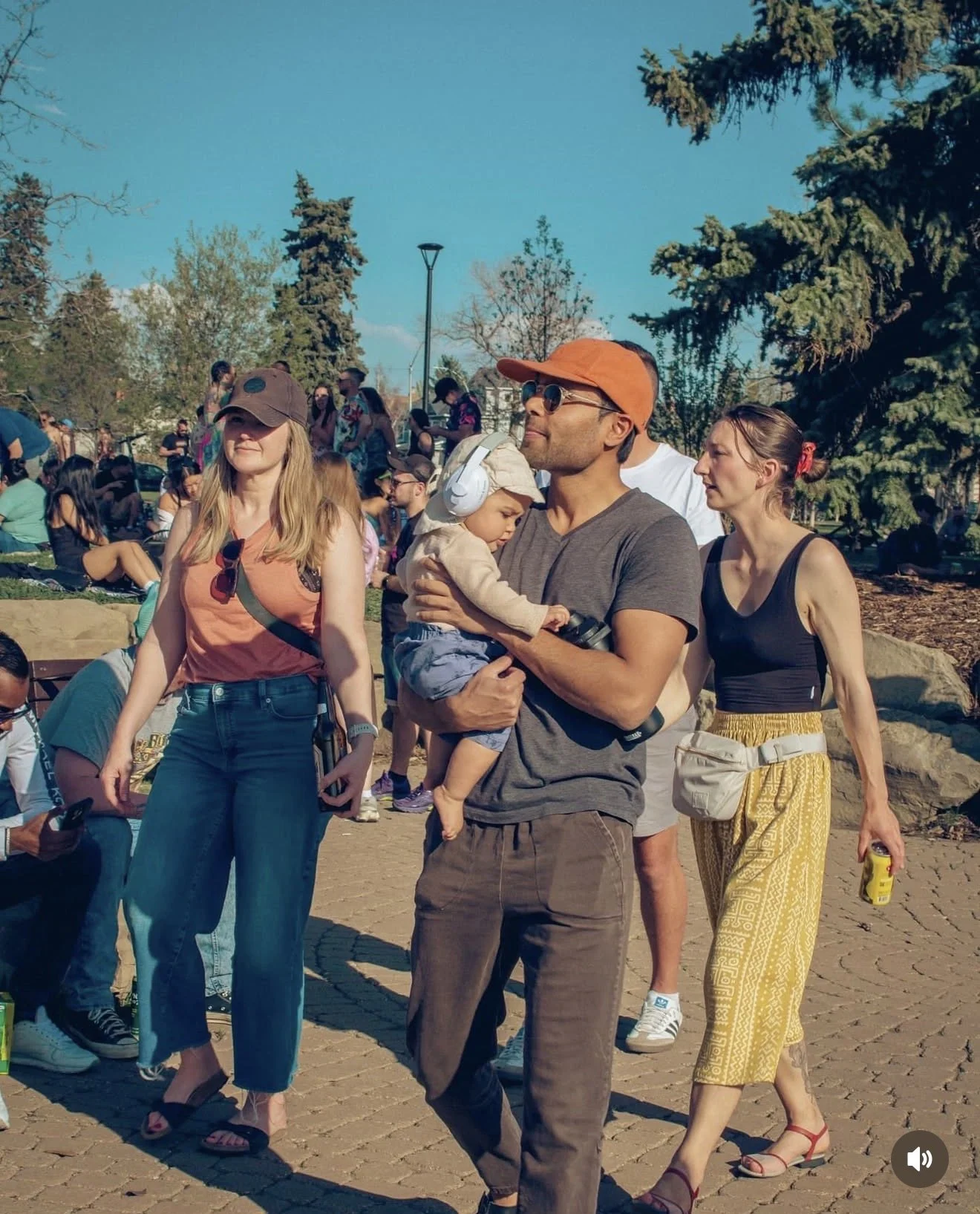 Families and friends at a free Dos Leches community gathering in a Calgary park