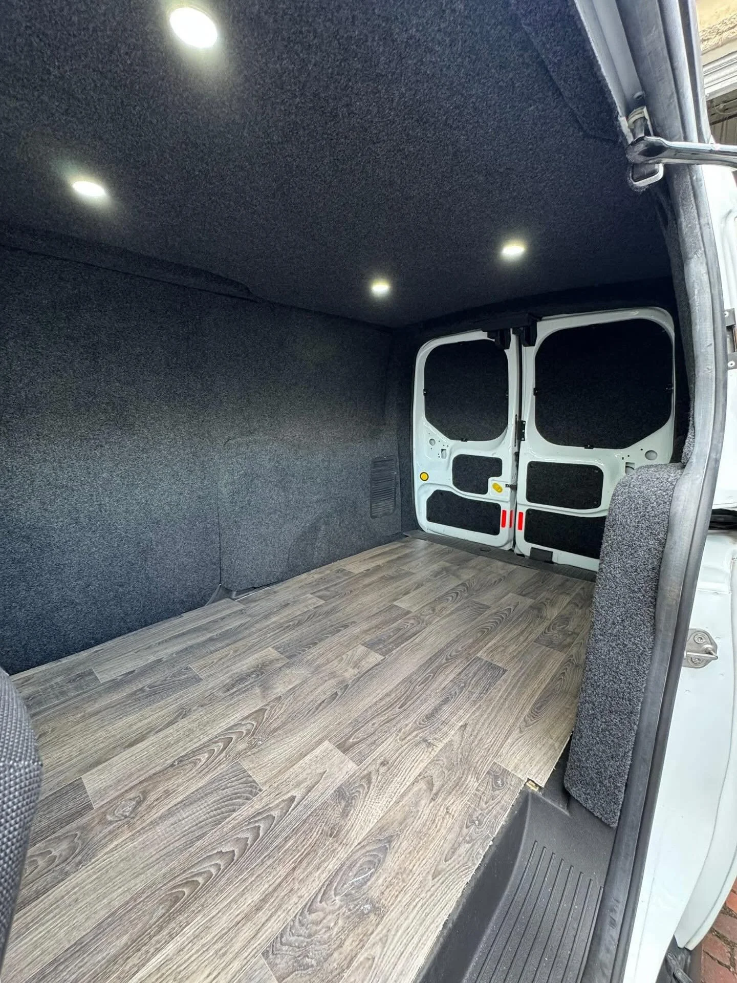 This LWB Ford Transit Connect came to us for full carpet lining, including roof lining with led spot lights.