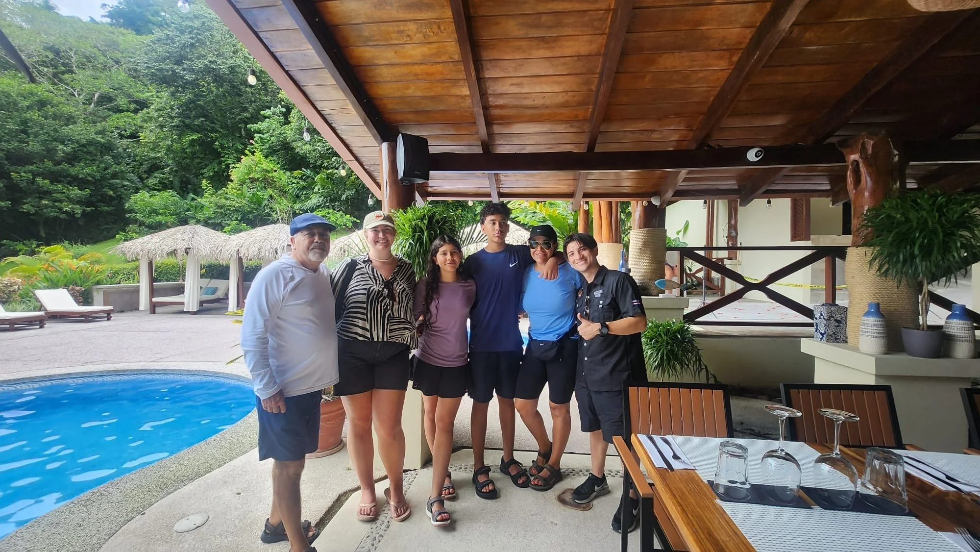 Our guide Albert with a family at their hotel before a private tour in Costa Rica