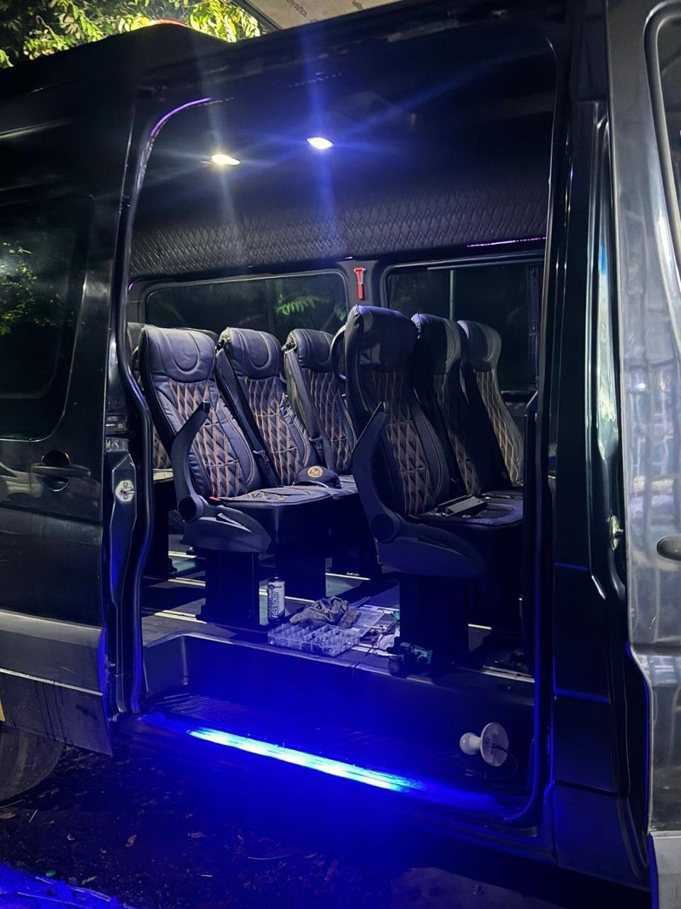 Leather seats inside our Mercedes-Benz Sprinter van for group transportation