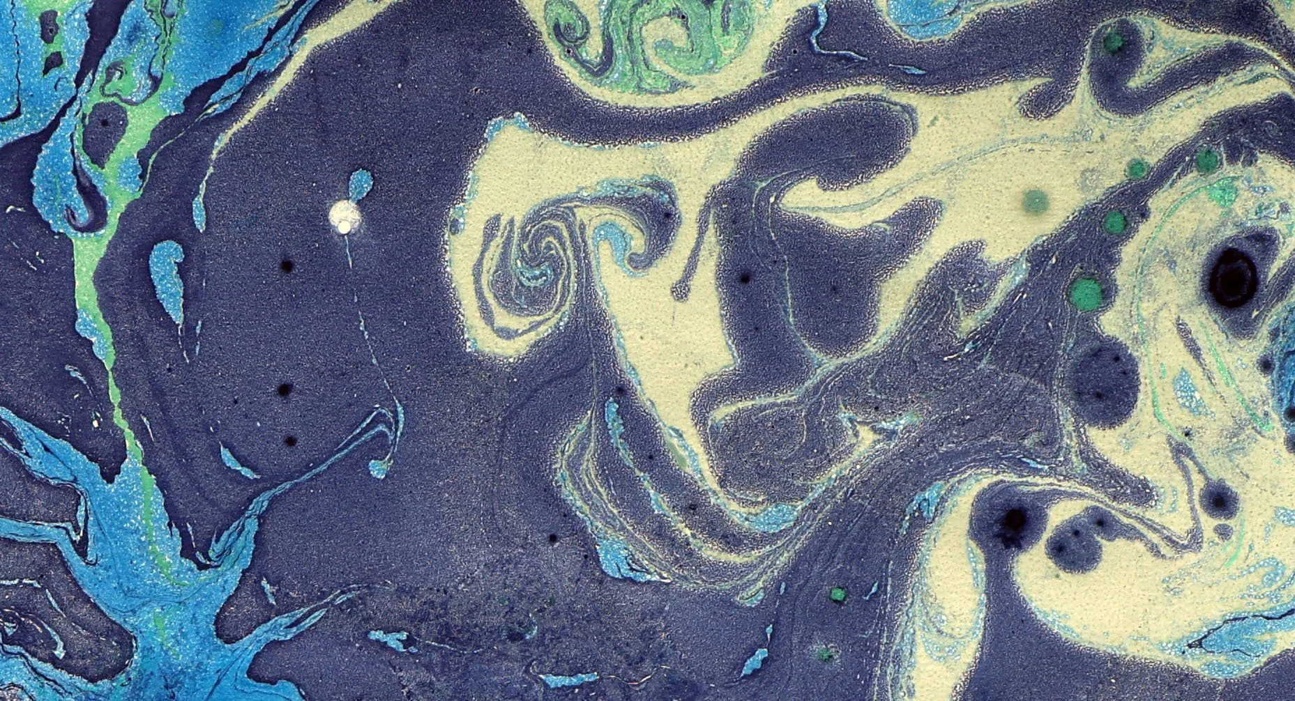 Abstract swirling pattern with navy blue, green, and light yellow colors resembling a fluid, marbled design.