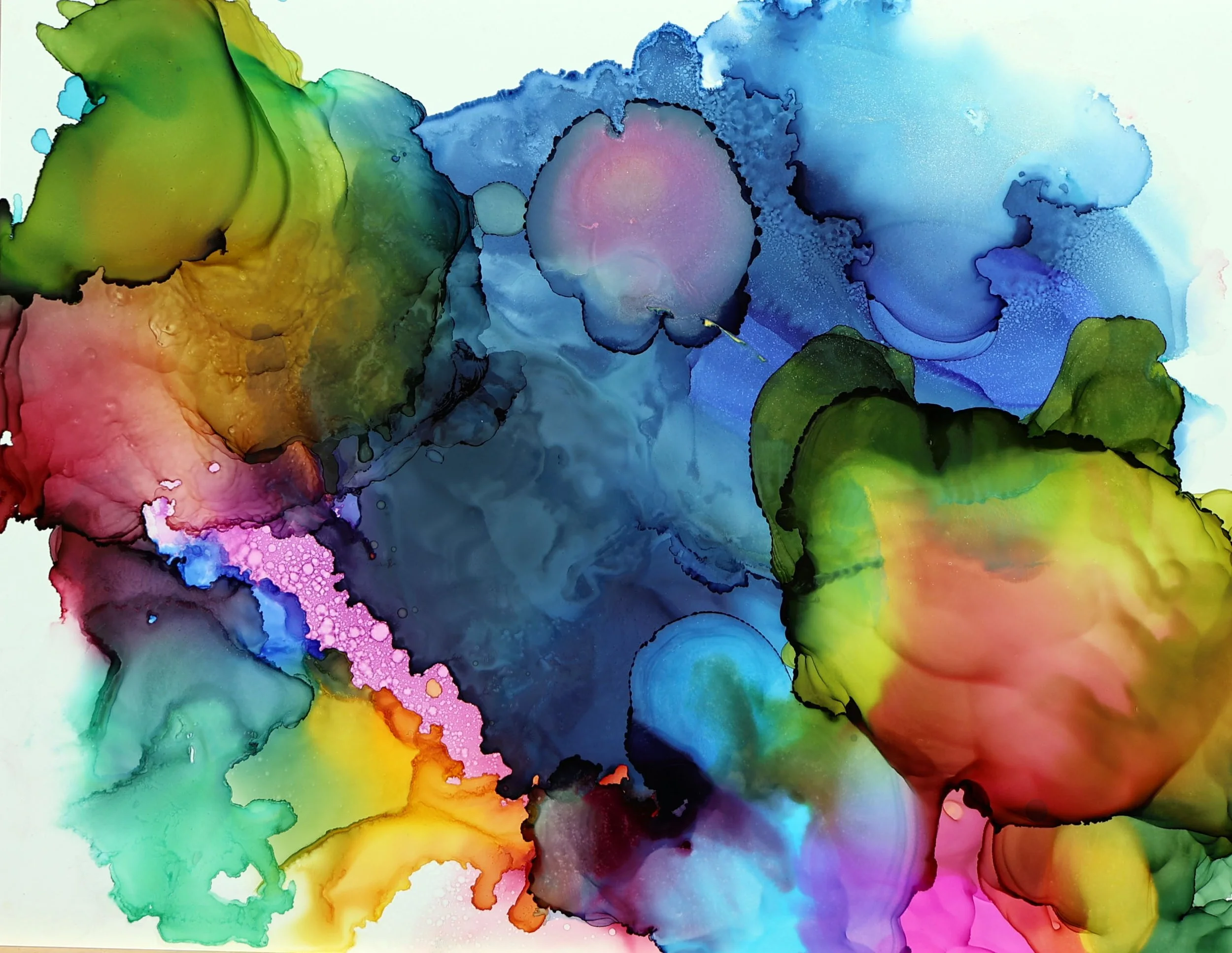 Colorful abstract watercolor painting with blending and bleeding of green, yellow, pink, blue, and purple hues.
