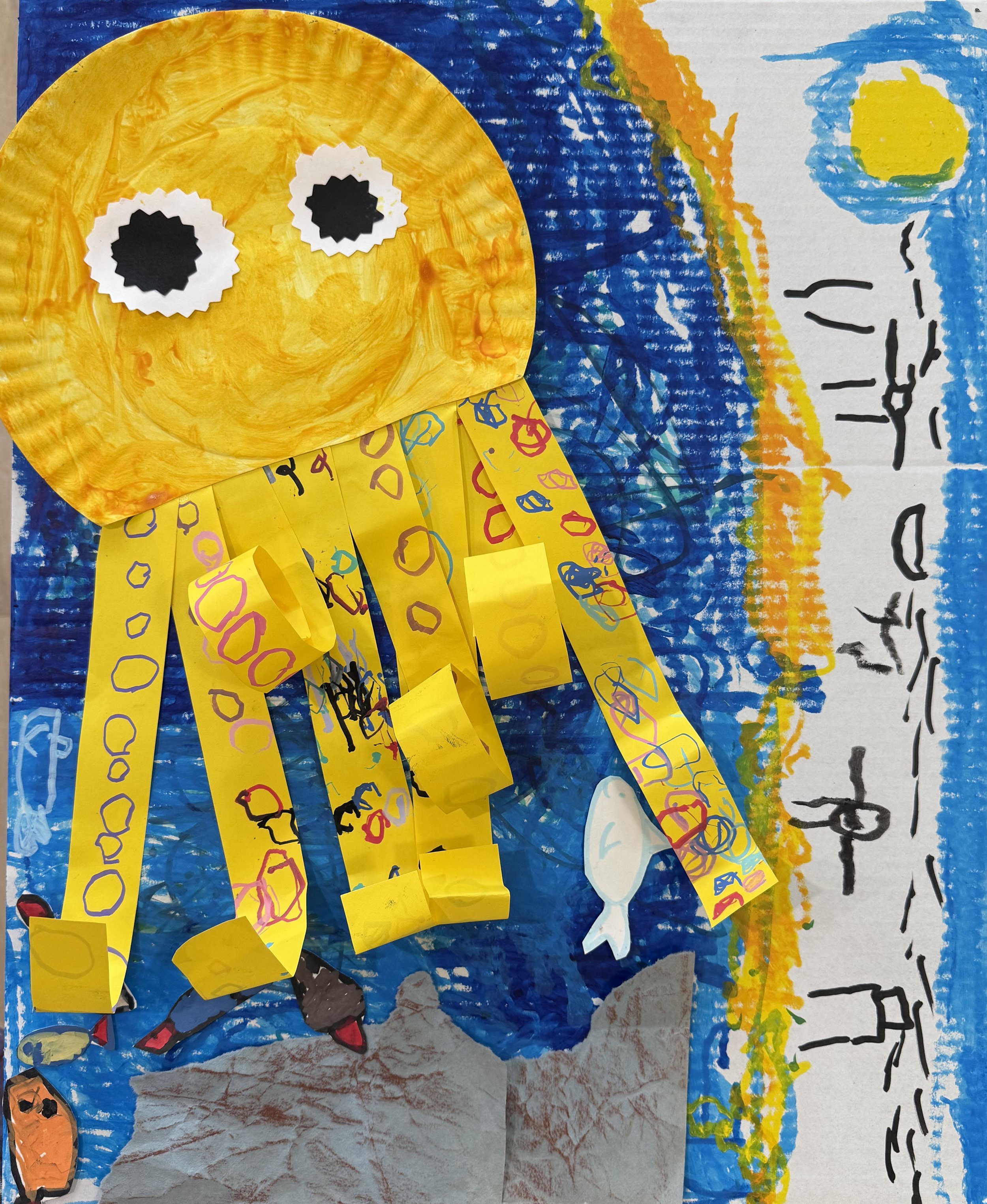 Child's colorful drawing of a rainbow with yellow, orange, blue, and green sections, cloud, and black text on the right side.
