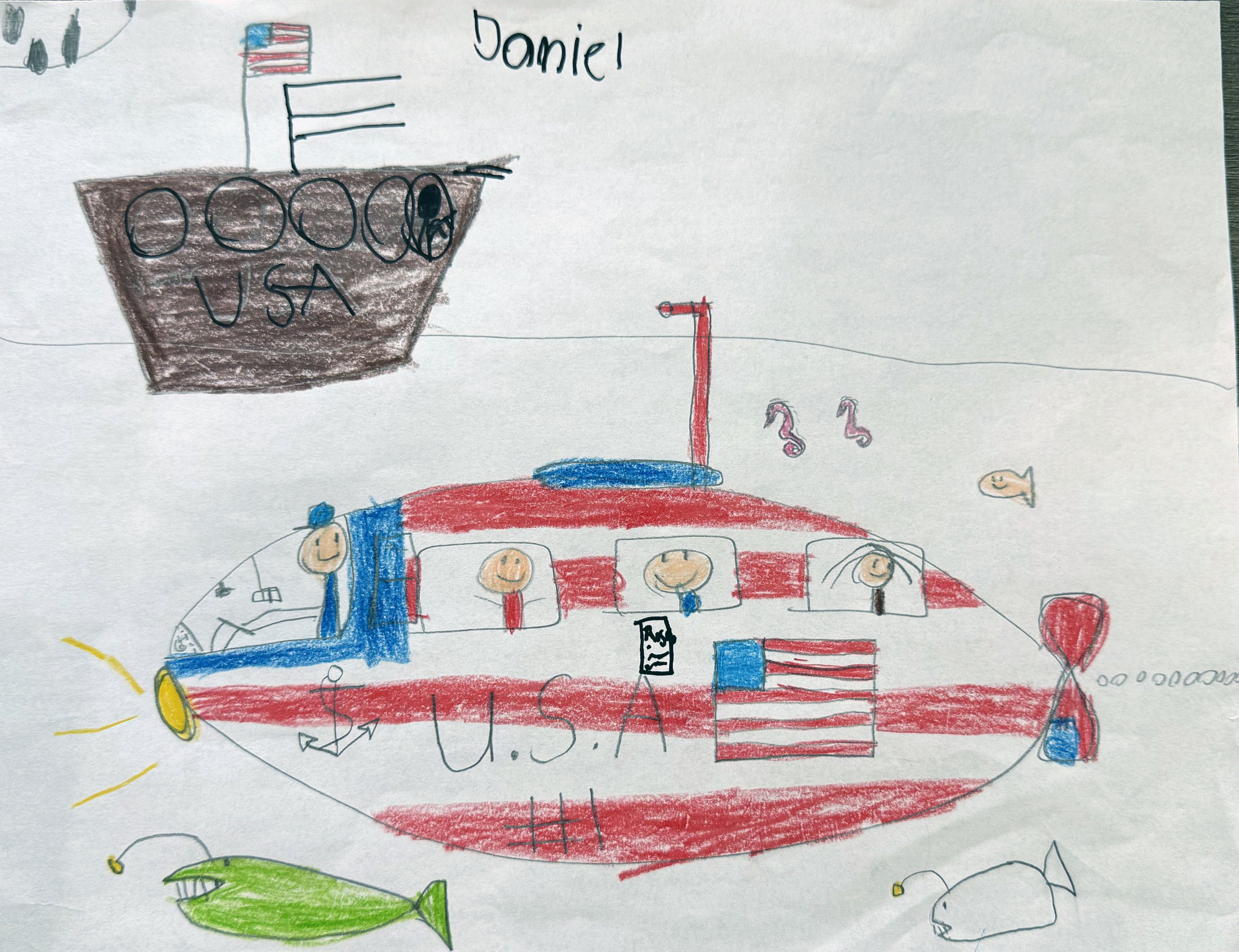 Child's drawing of a helicopter decorated with U.S.A. flag colors and design, with smiling faces of people visible through the windows, surrounded by fish and an American battleship in the background.