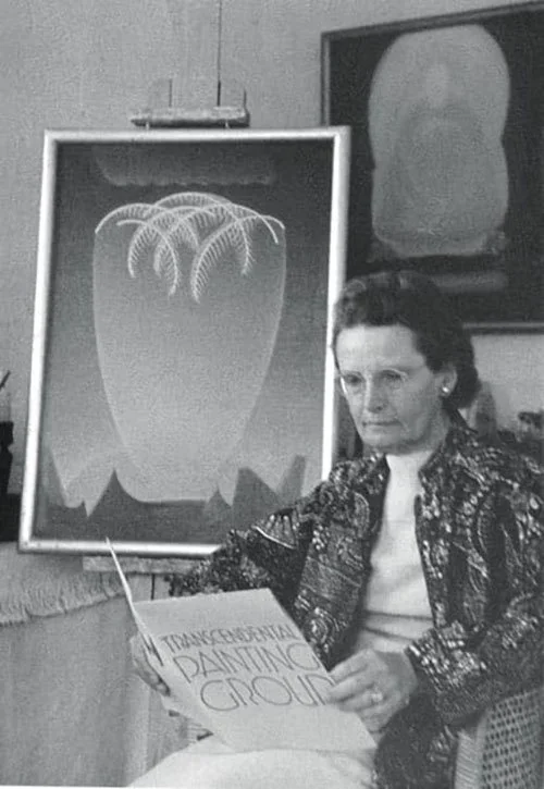 Agnes Pelton, contentedly reading the Transcendental Painting Group catalog
