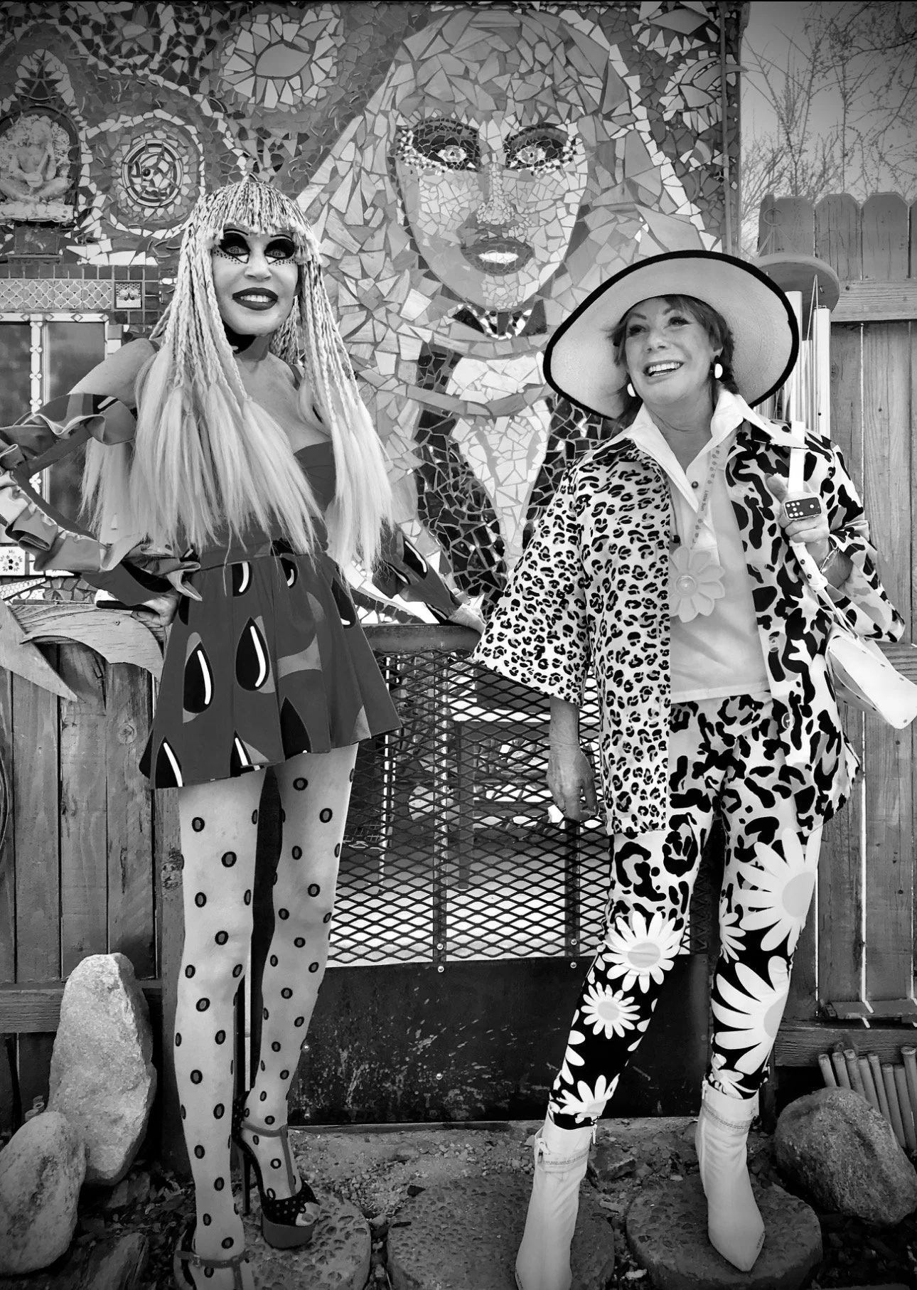 Karen Barone and a friend in front of her mosaic portrait.