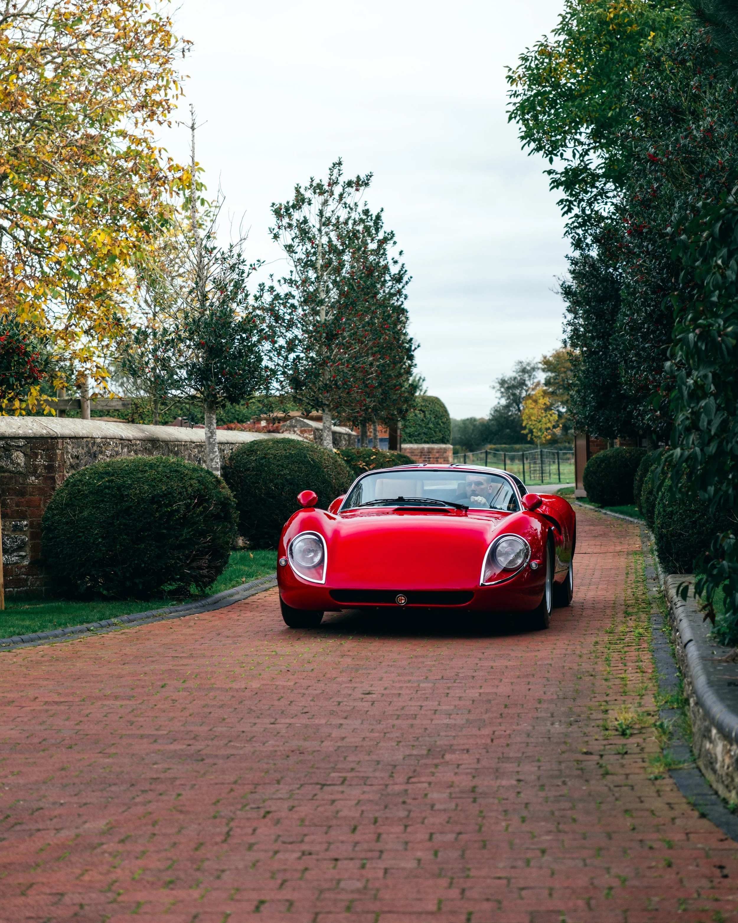 R33 Stradale Driving Down a Driveway Shot
