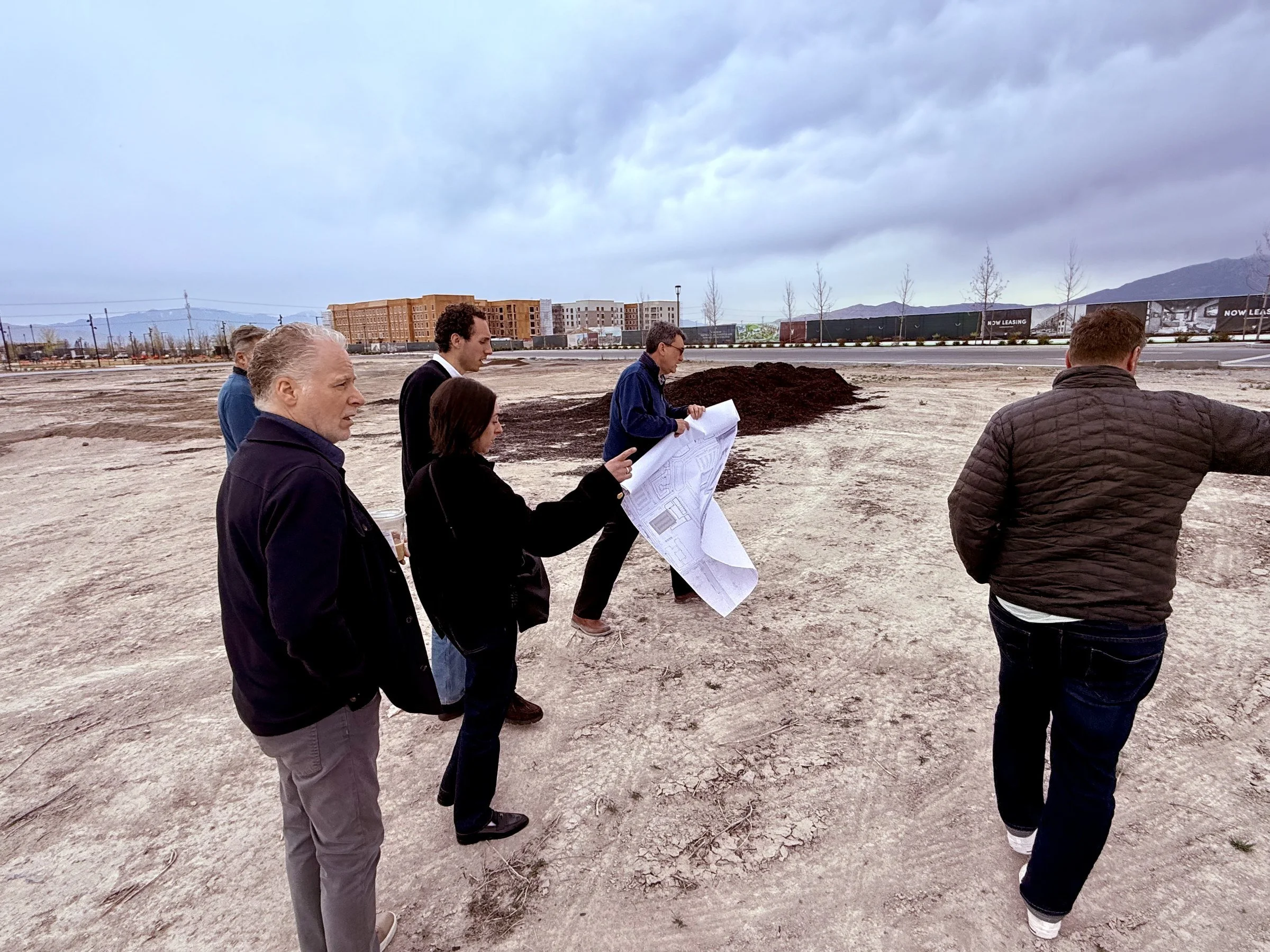 Project team reviewing plans on the future downtown site at Utah City, Vineyard, Utah.