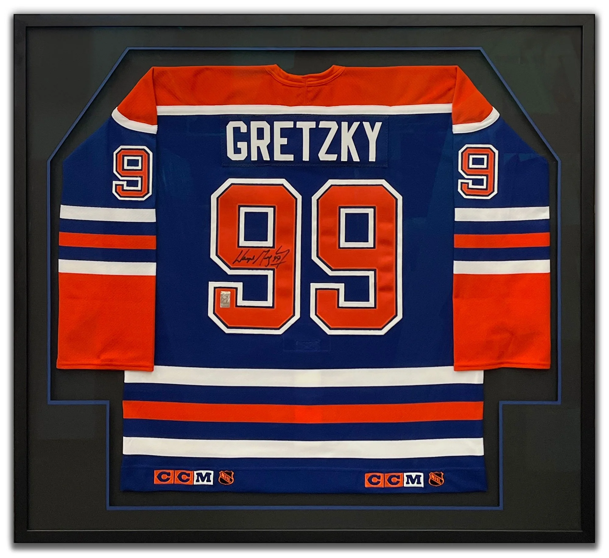 Signed Wayne Gretzky jersey custom framed with a double mat, hand-pinned and archivally mounted by Andrew Legere.