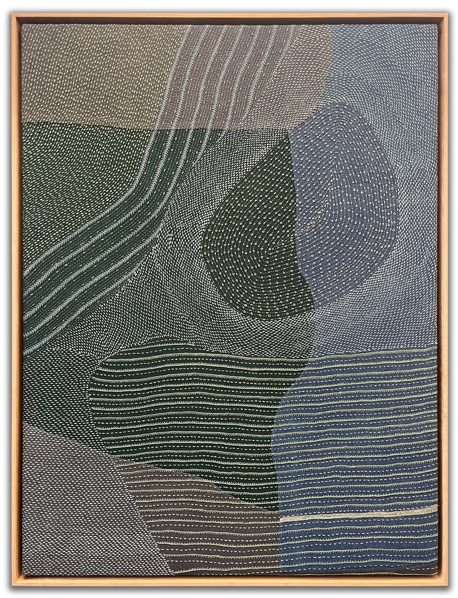 Large woven textile artwork stretched and mounted in a custom oak floater frame, professionally framed by Andrew Legere. Ideal example of Canvas Stretching & Float Framing.