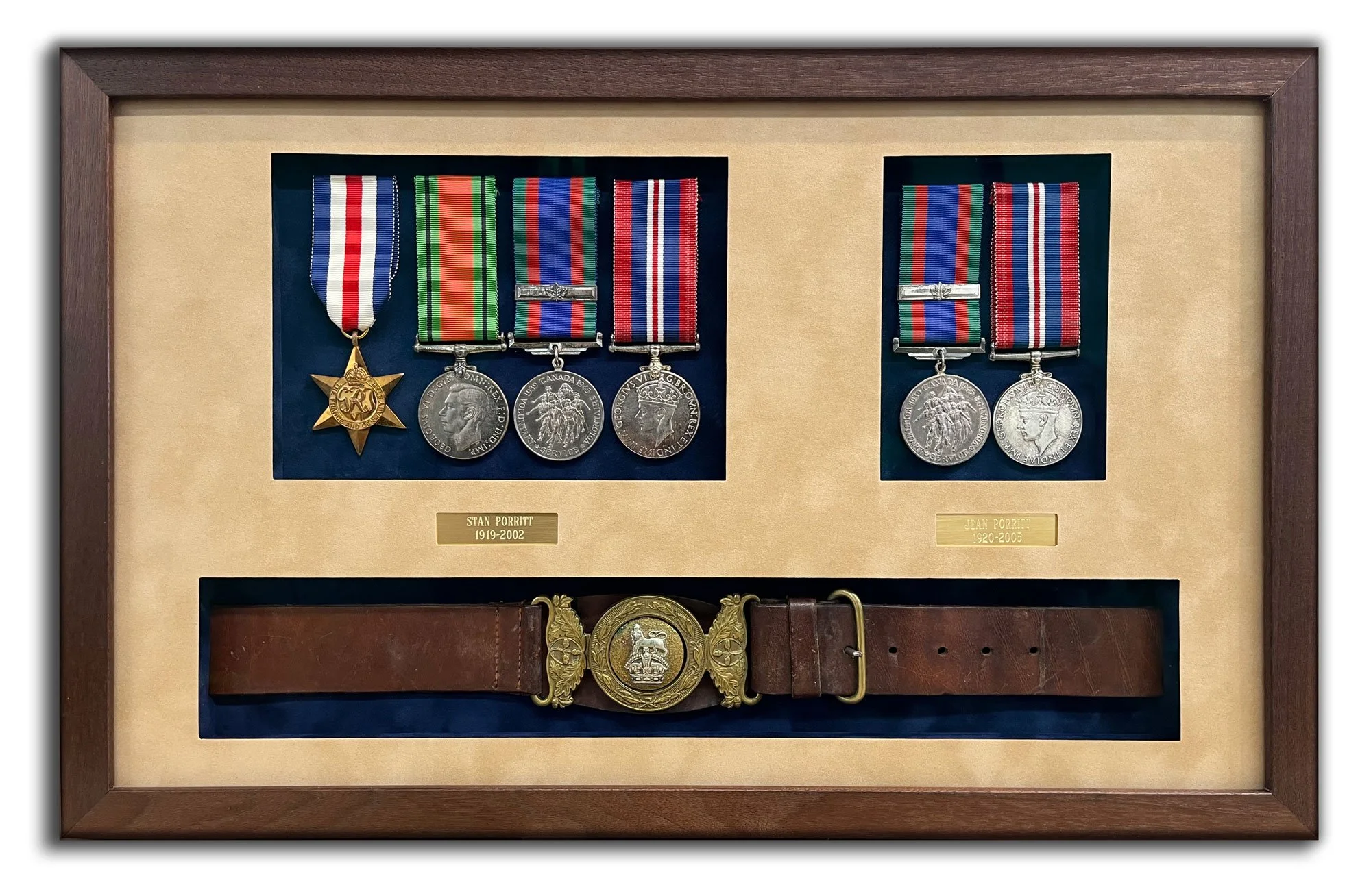 Custom walnut shadowbox featuring military medals and a ceremonial belt mounted on brown and blue suede, with engraved plates, designed and framed by Andrew Legere in a previous professional studio.