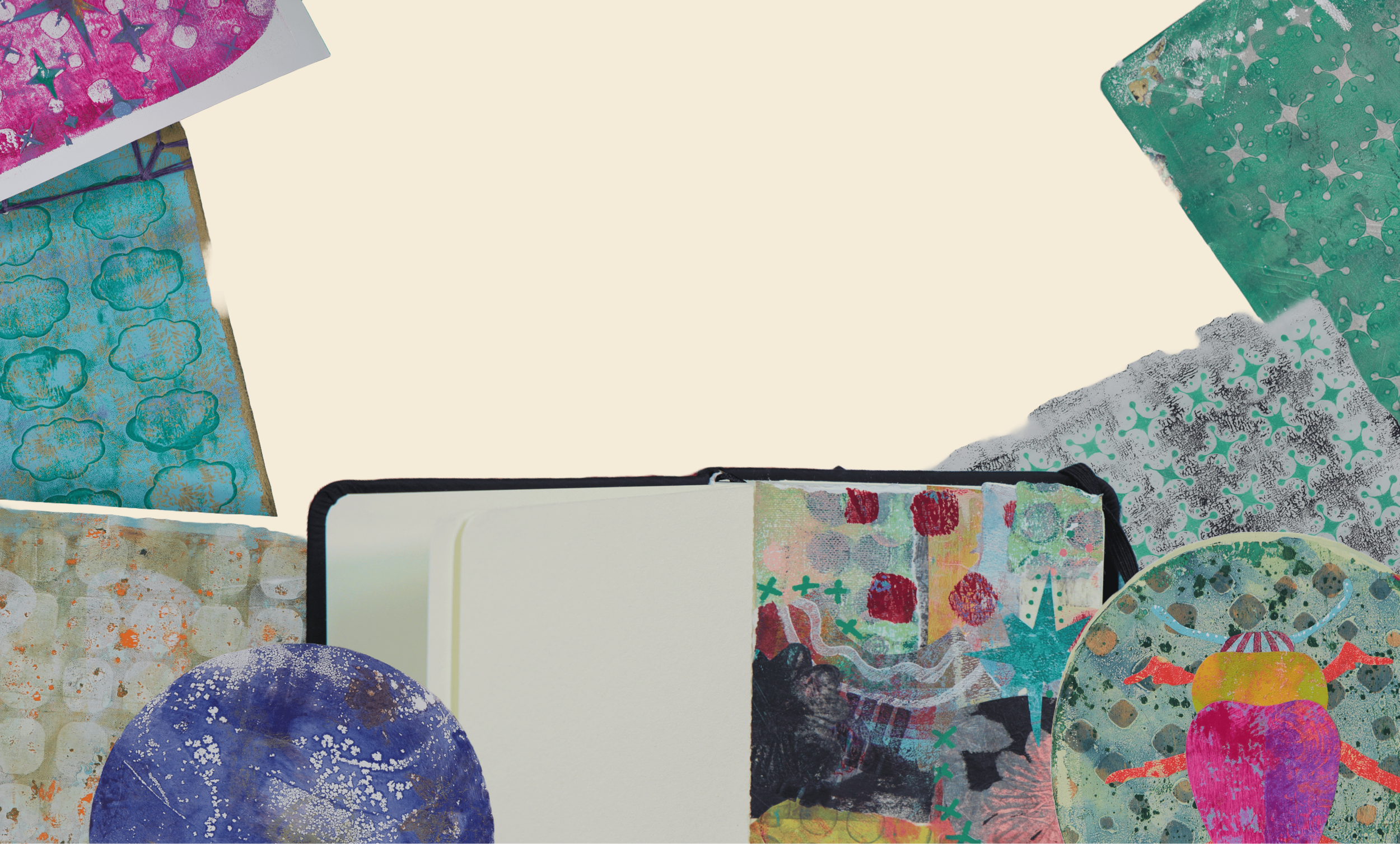 Collection of colorful, abstract papers and artworks with various patterns and textures, arranged around an open notebook on a light background.