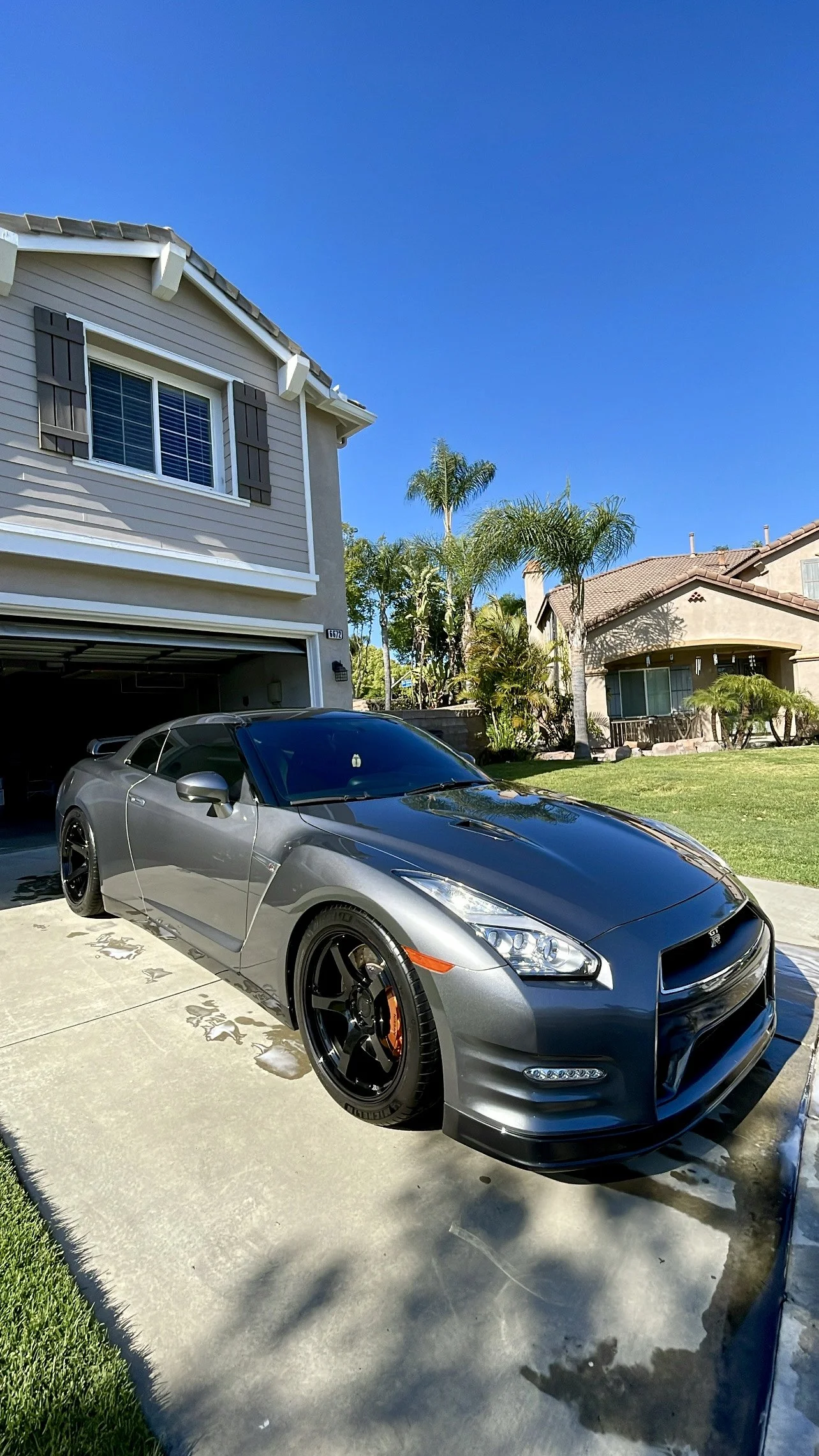 Nissan GT-R parked in a residential driveway after professional mobile car detailing service