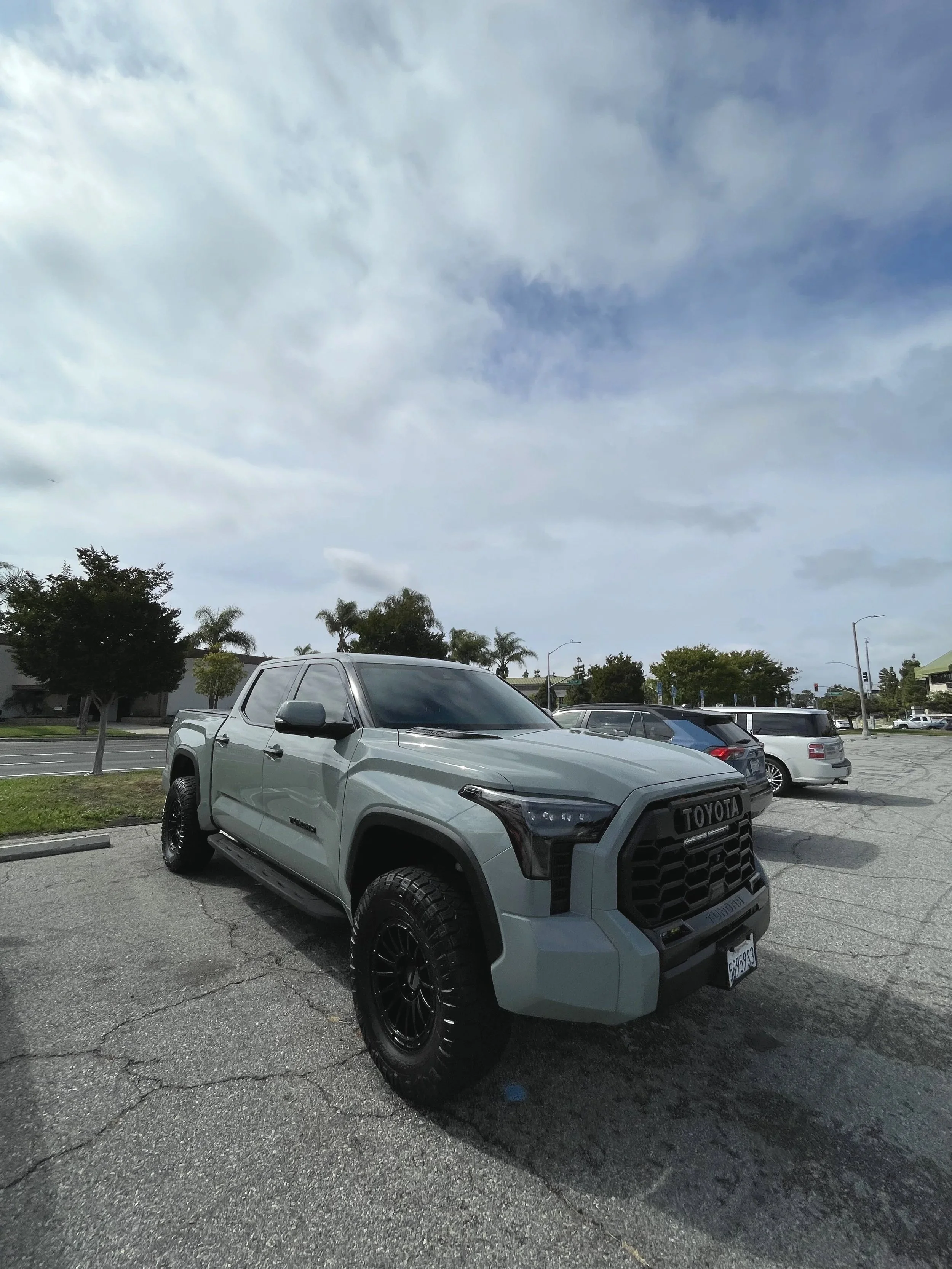 Toyota Tundra parked outdoors after a detail, featuring clean paint, black off-road wheels, and a fresh finish
