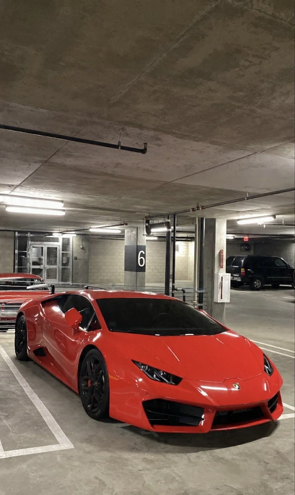 Red Lamborghini receiving professional mobile auto detailing service in Carson, CA