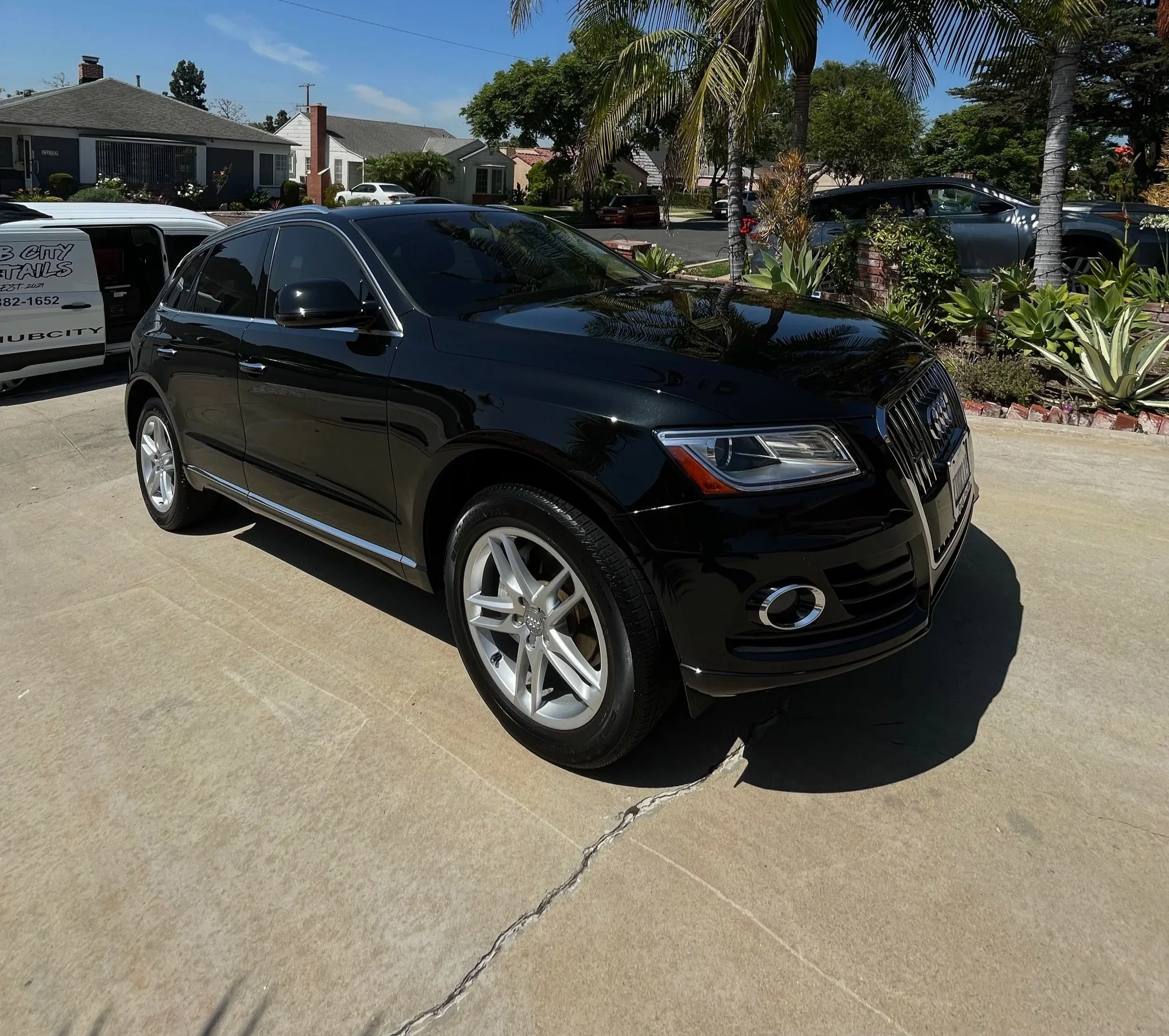 Black Audi sedan parked with a clean, glossy exterior
