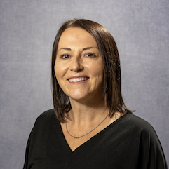Cindy Fornes smiling with medium length brown hair