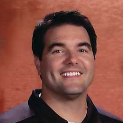 Steve Moraca smiling with short dark drown hair