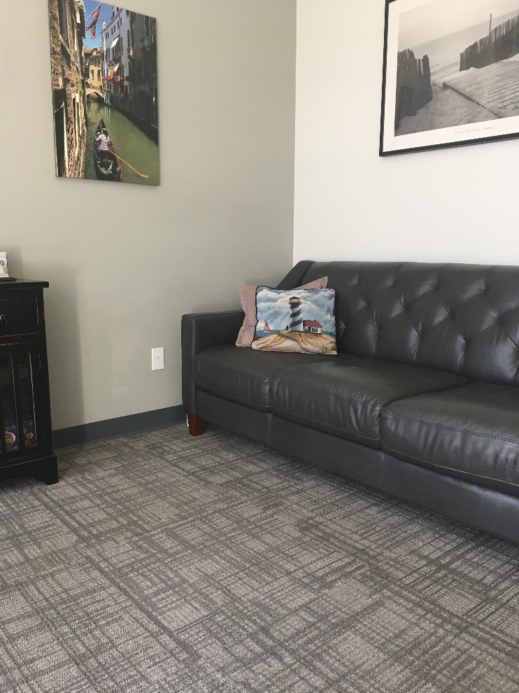Dark leather couch in a relaxing room.