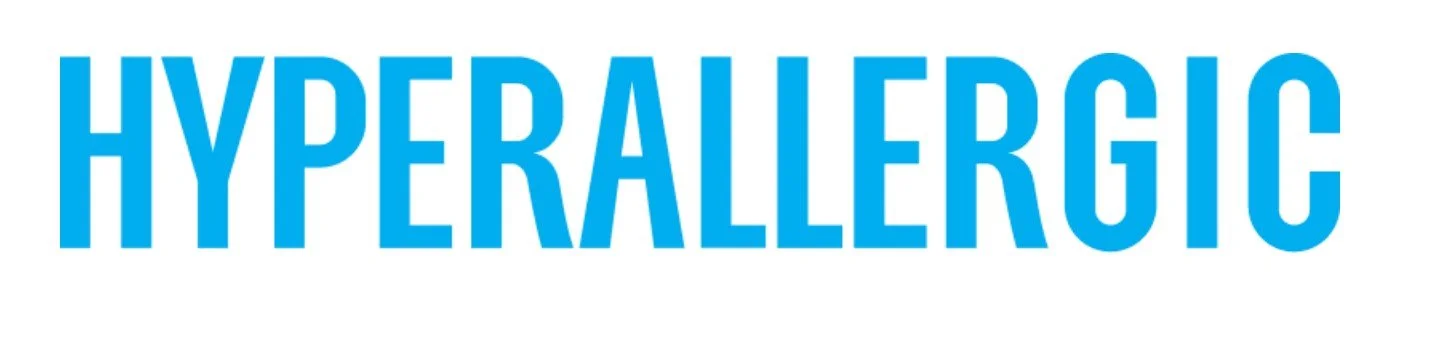 Text reading 'HYPERALERGIC' in bold blue letters on a white background.