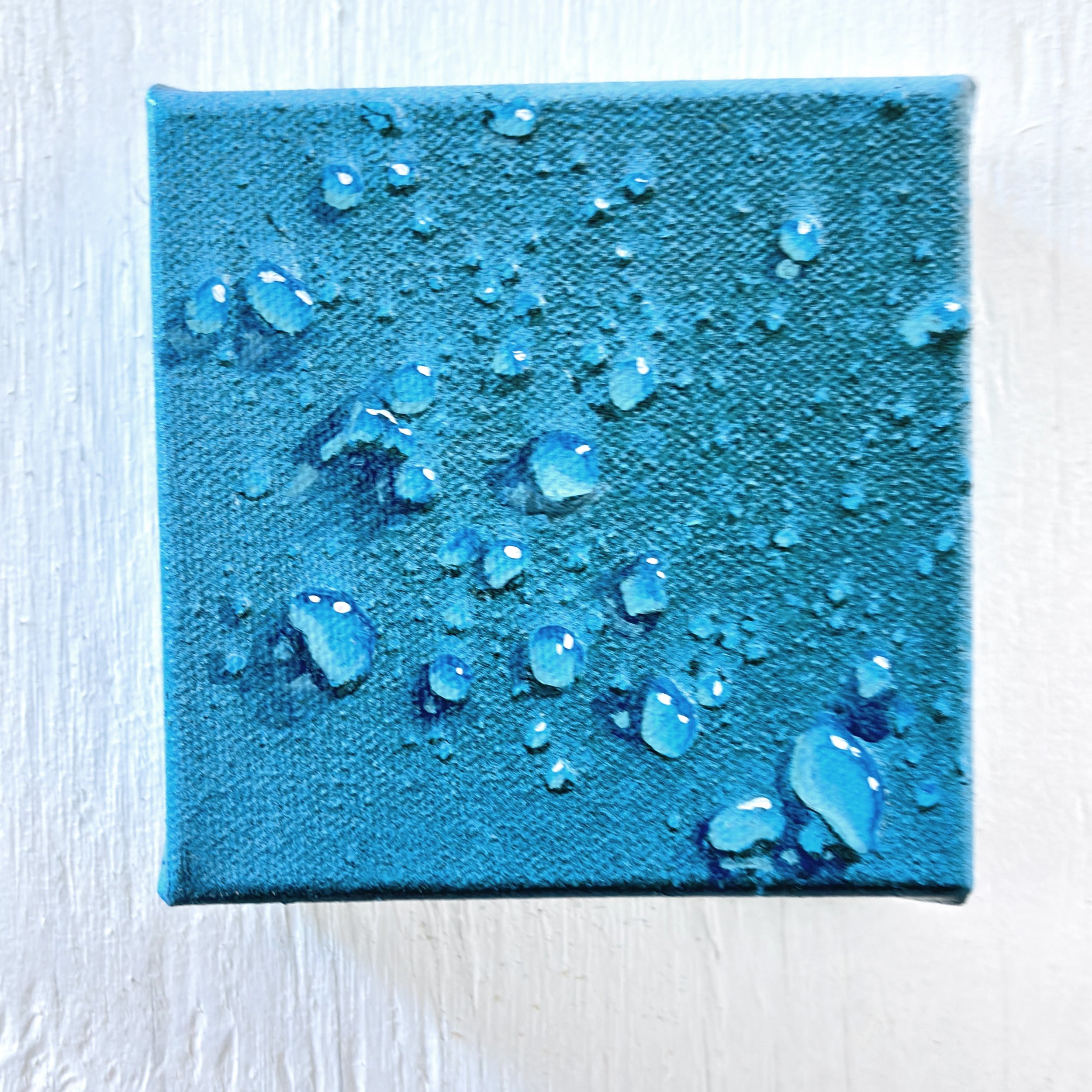 Painting of water drops on a blue background