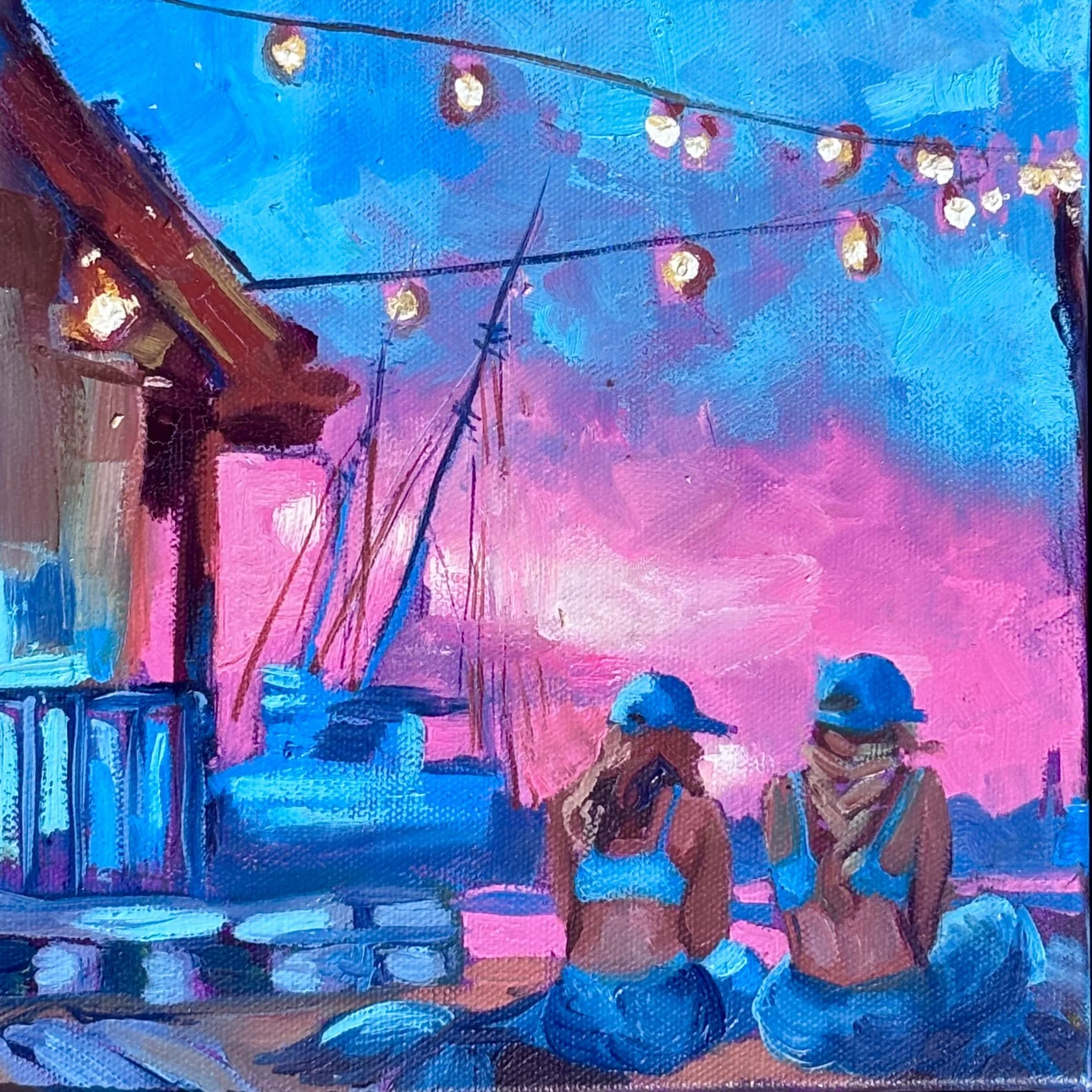 Painting of mermaids sitting and watching the sunset