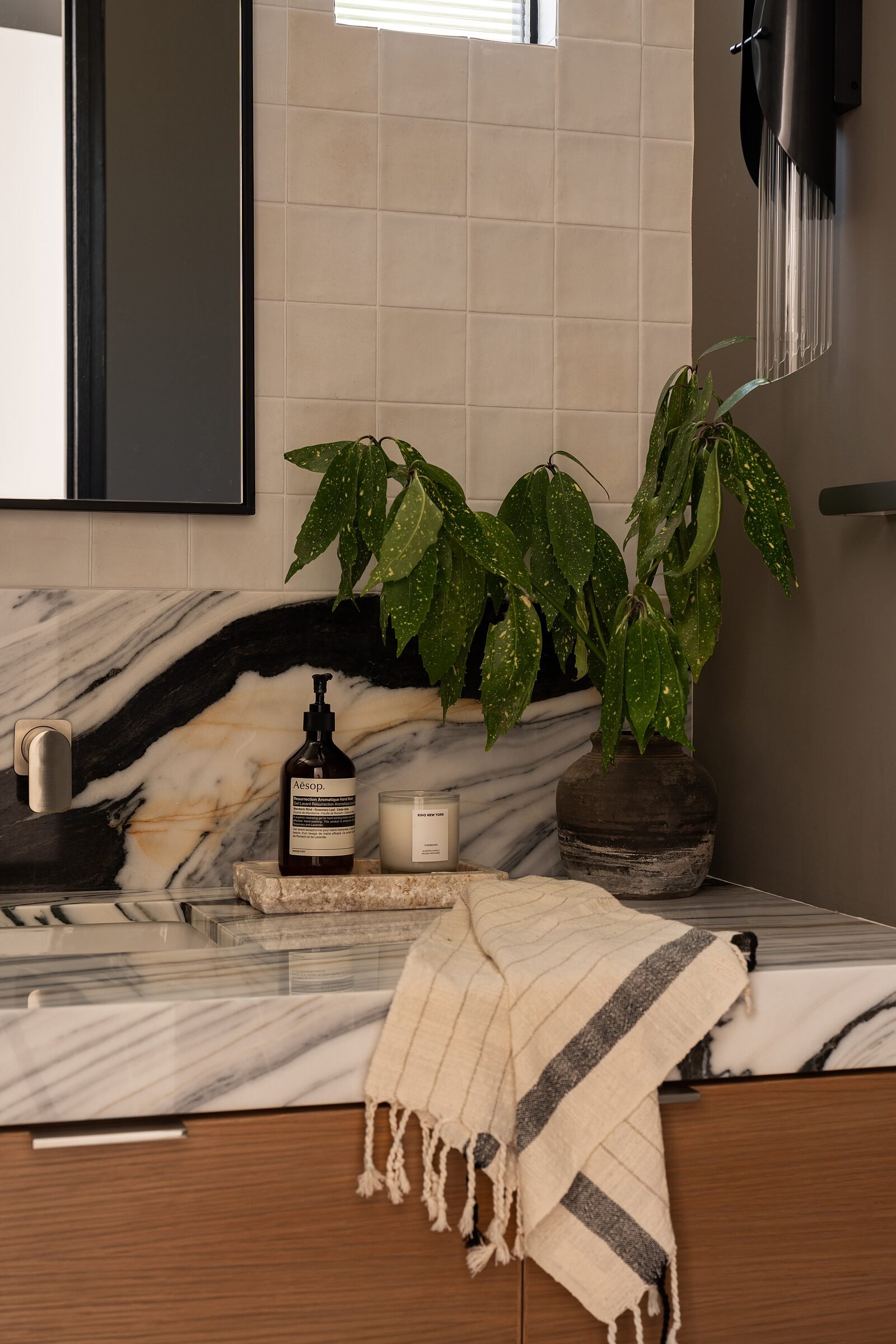 Bianco Lasa marble backsplash and counter detail in a powder room