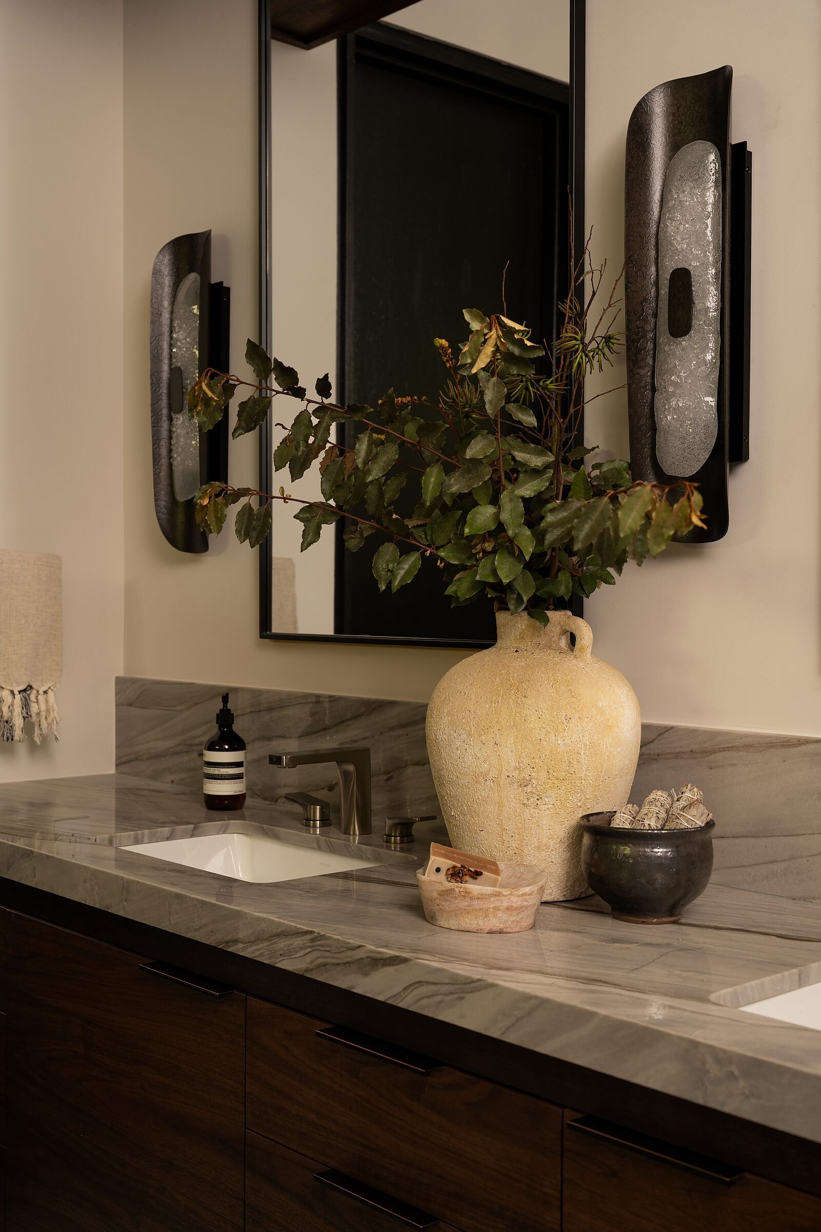 Silver Moon quartzite counter detail with ceramic vessel in a primary bath