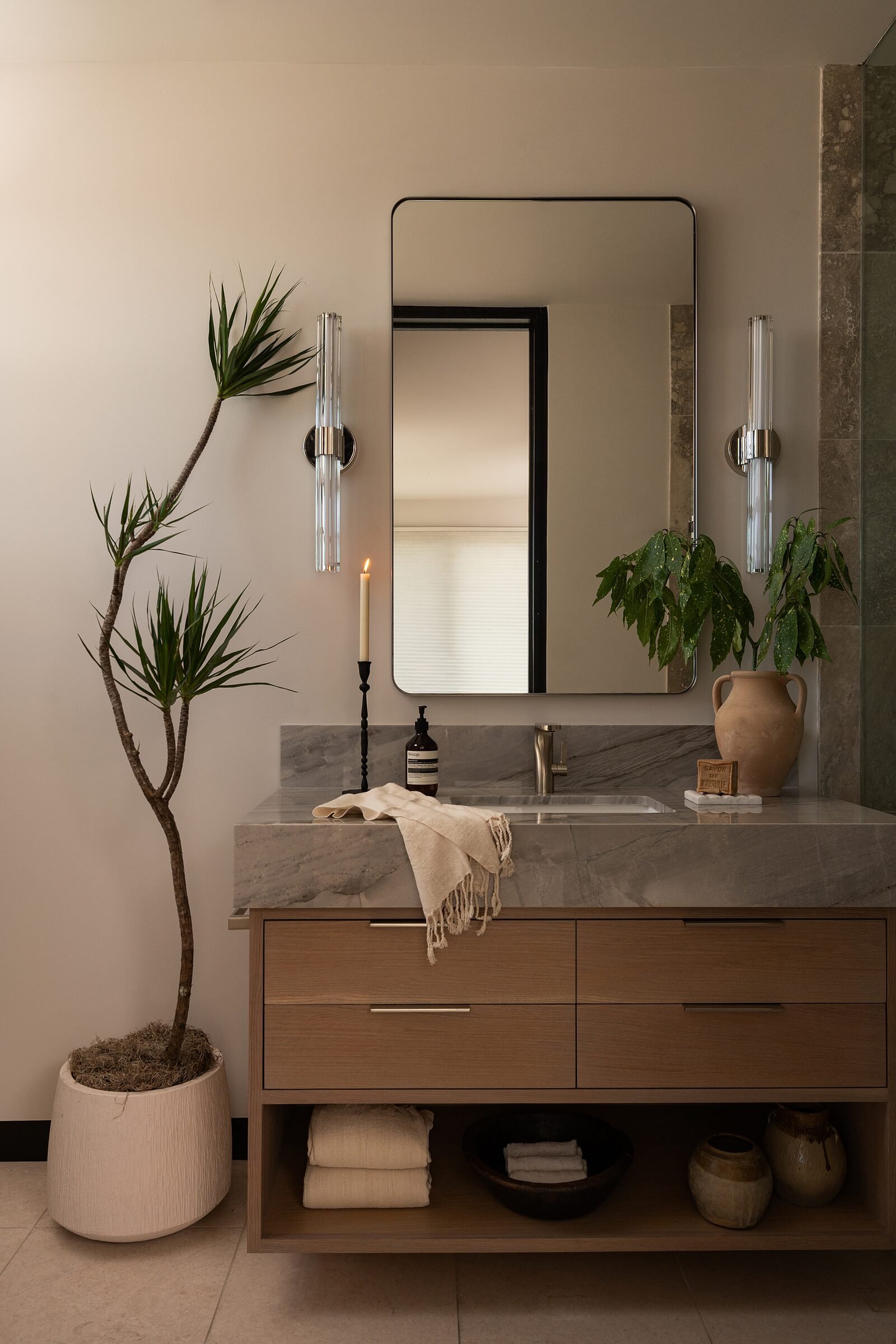 White oak vanity with Silver Moon quartzite counter in the daughter's bath