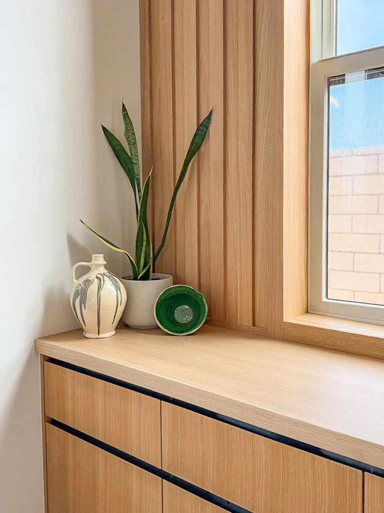 white oak slat wall green pottery 