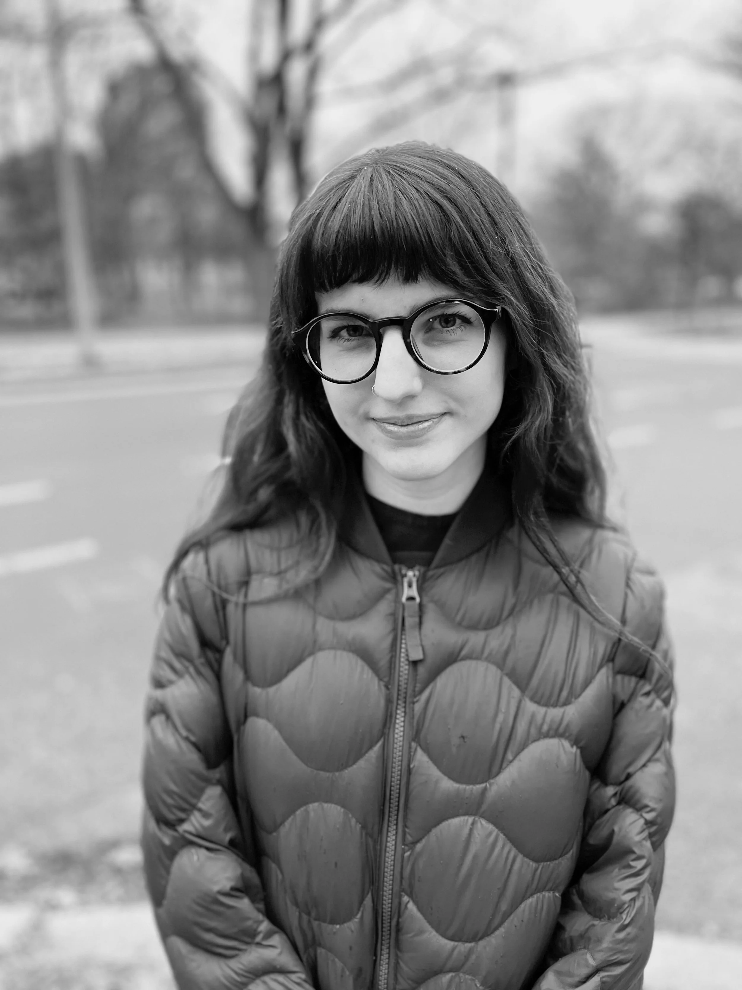 Portrait of the artist standing outside