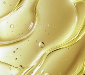 List of Enhancements at MoonSun Esthetics - Close-up of a translucent yellow liquid with bubbles and smooth flowing texture.