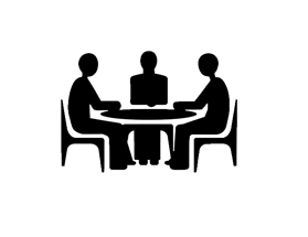 Silhouette of three people sitting at a table in a discussion