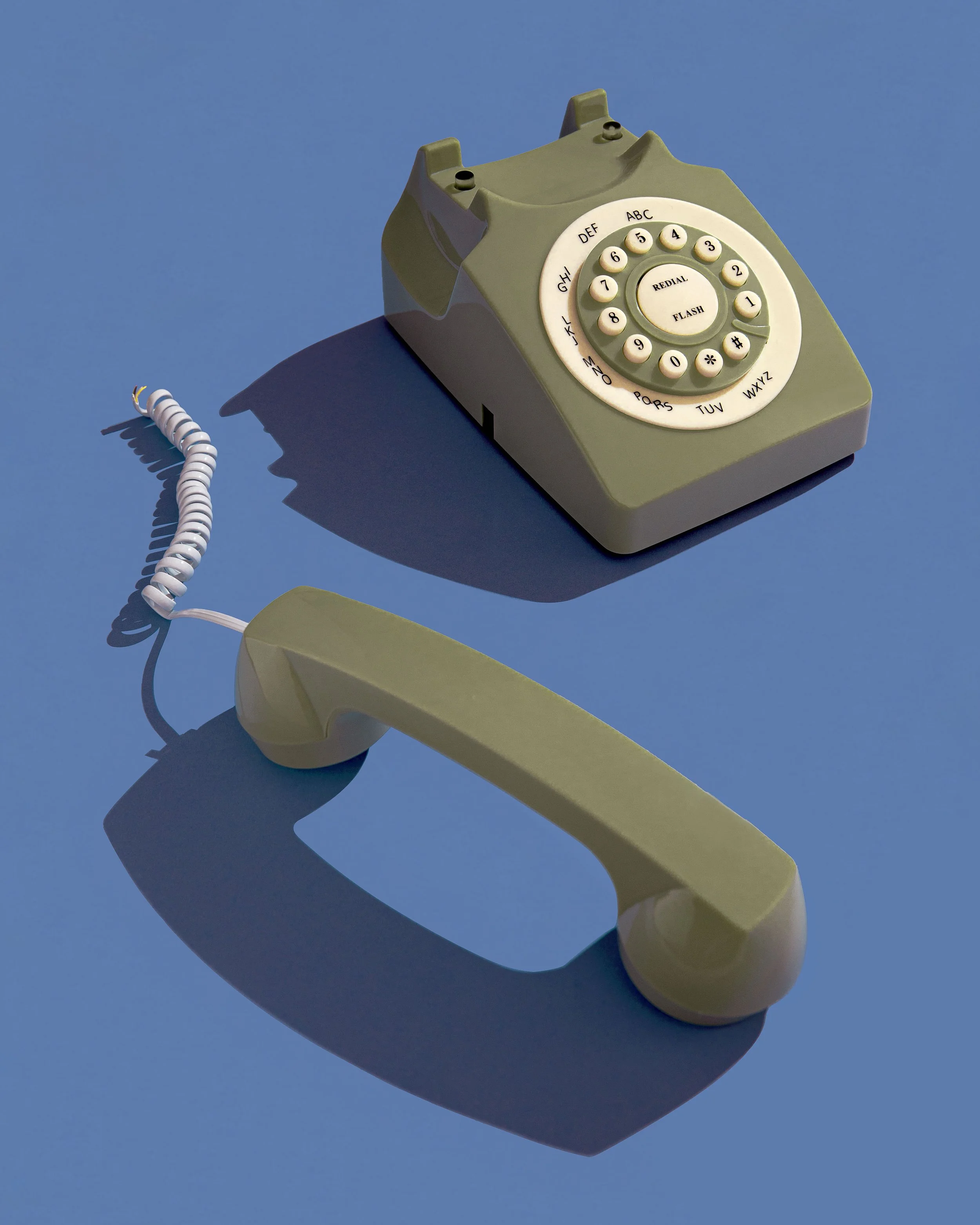 A vintage telephone with its cord cut, symbolising disconnection, lack of communication, and isolation.