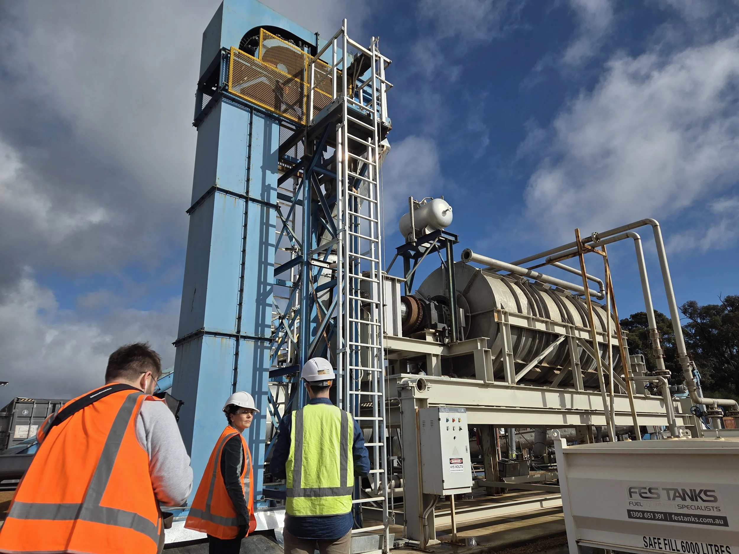 stakeholders standing in front of a pyrolysis plant in western australia