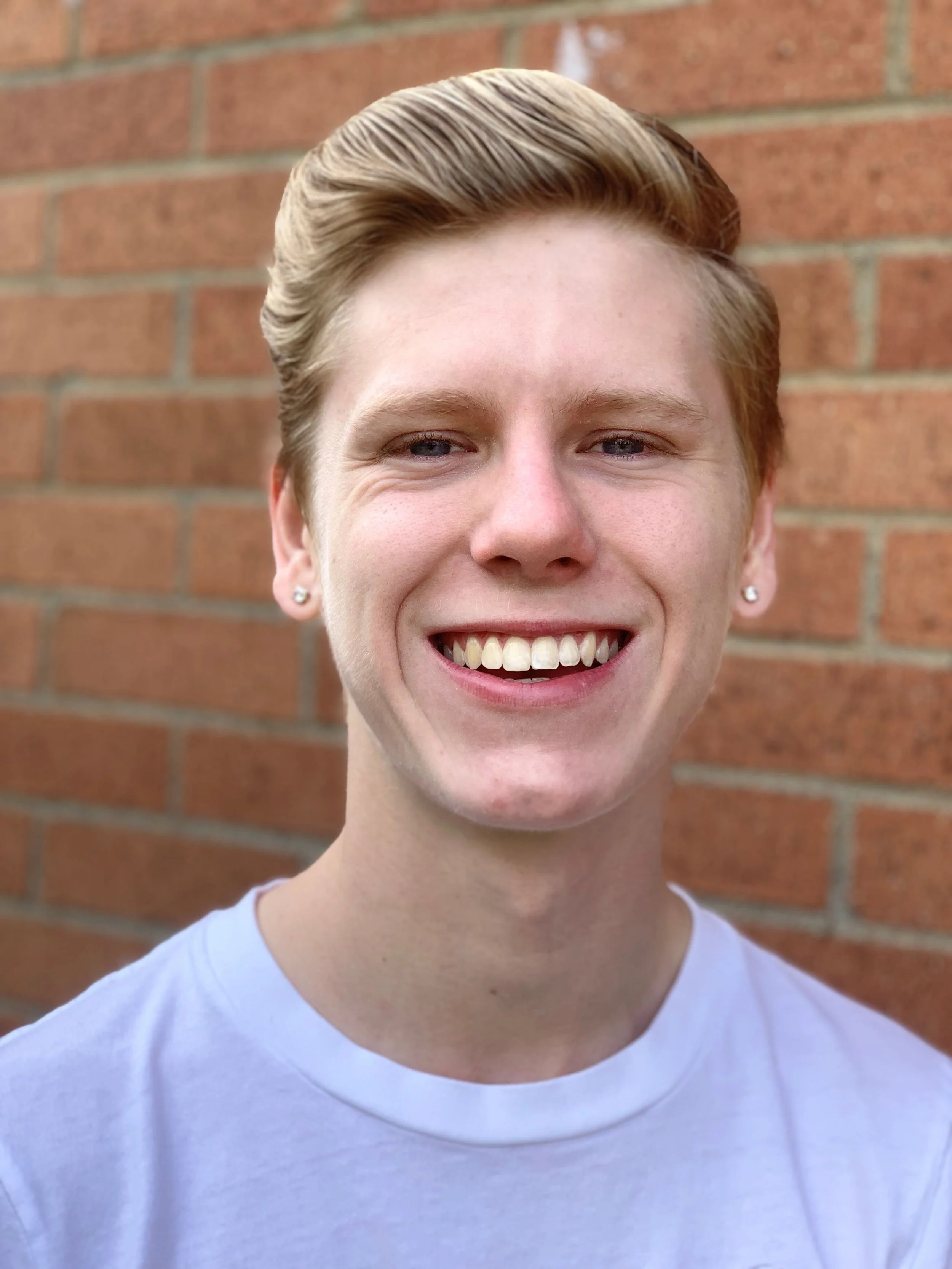 A logo for Stage 62, with 'Stage 62' spelled out in gray lettering with white dots.