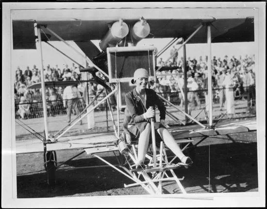 Amelia Earhart in old plane.jpg